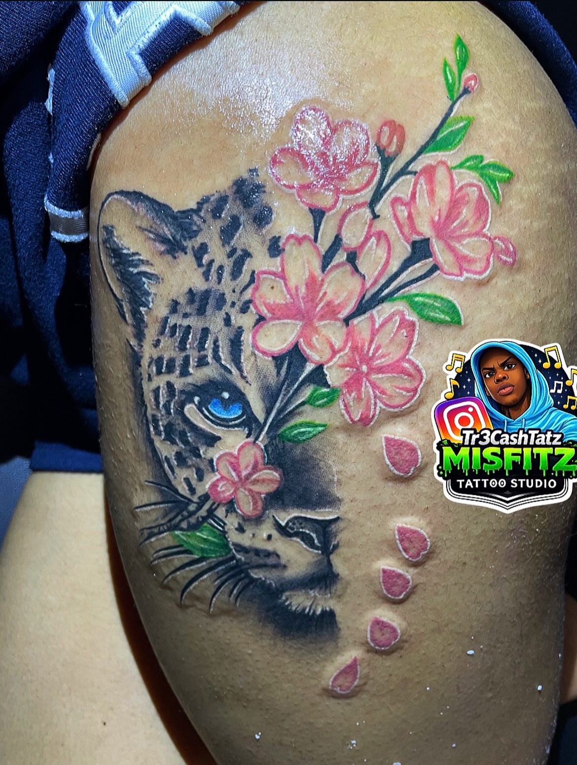 Jaguar with cherry blossoms realism tattoo on the thigh by TreCashTats💉🩸 MisfitzTattooStudio
