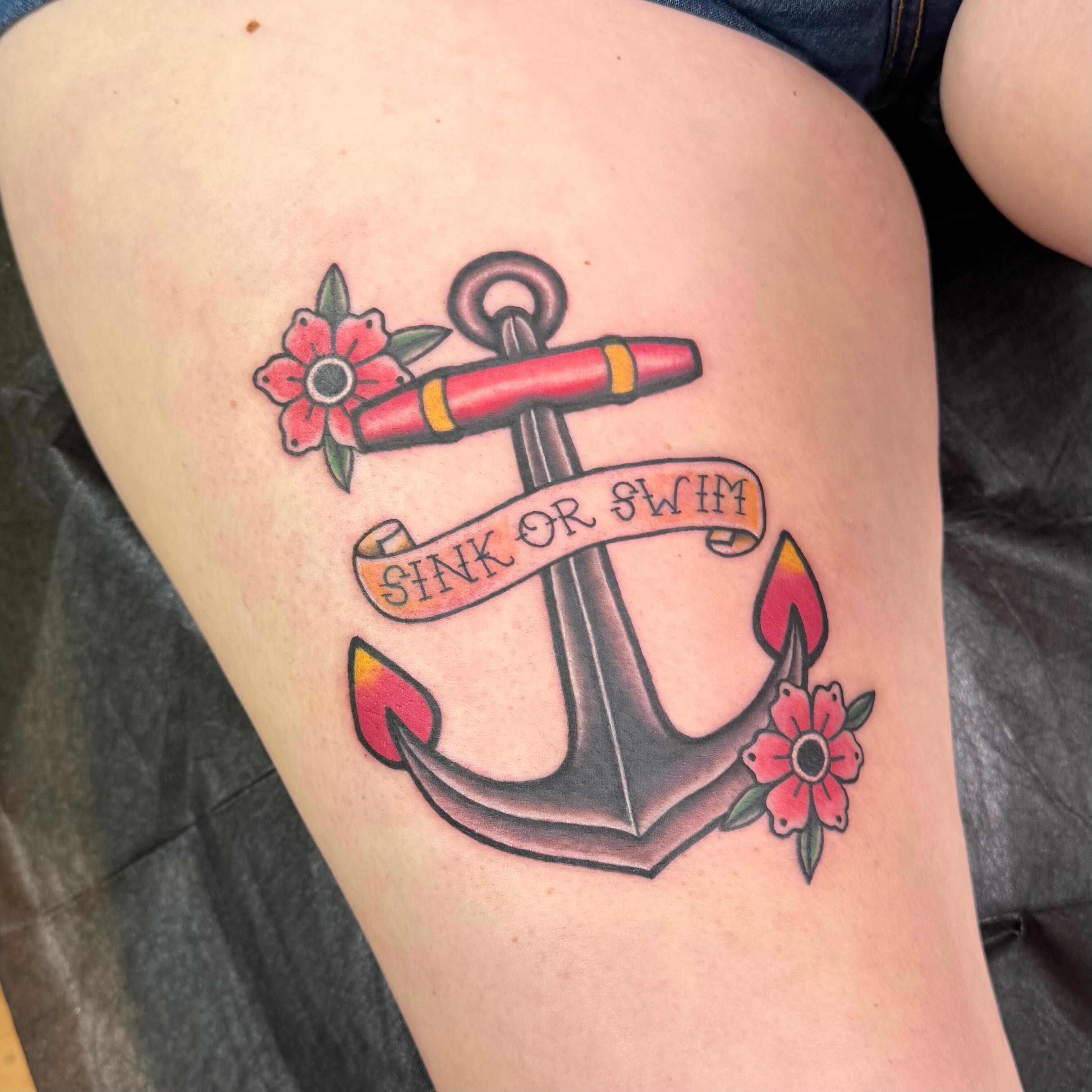 Anchor with floral accents American traditional tattoo on the thigh by Nic