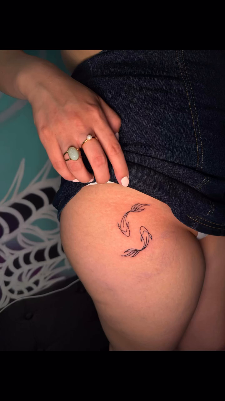 Koi fish tattoo fine line tattoo on the leg by Tony Hernandez, Chicago, Illinois