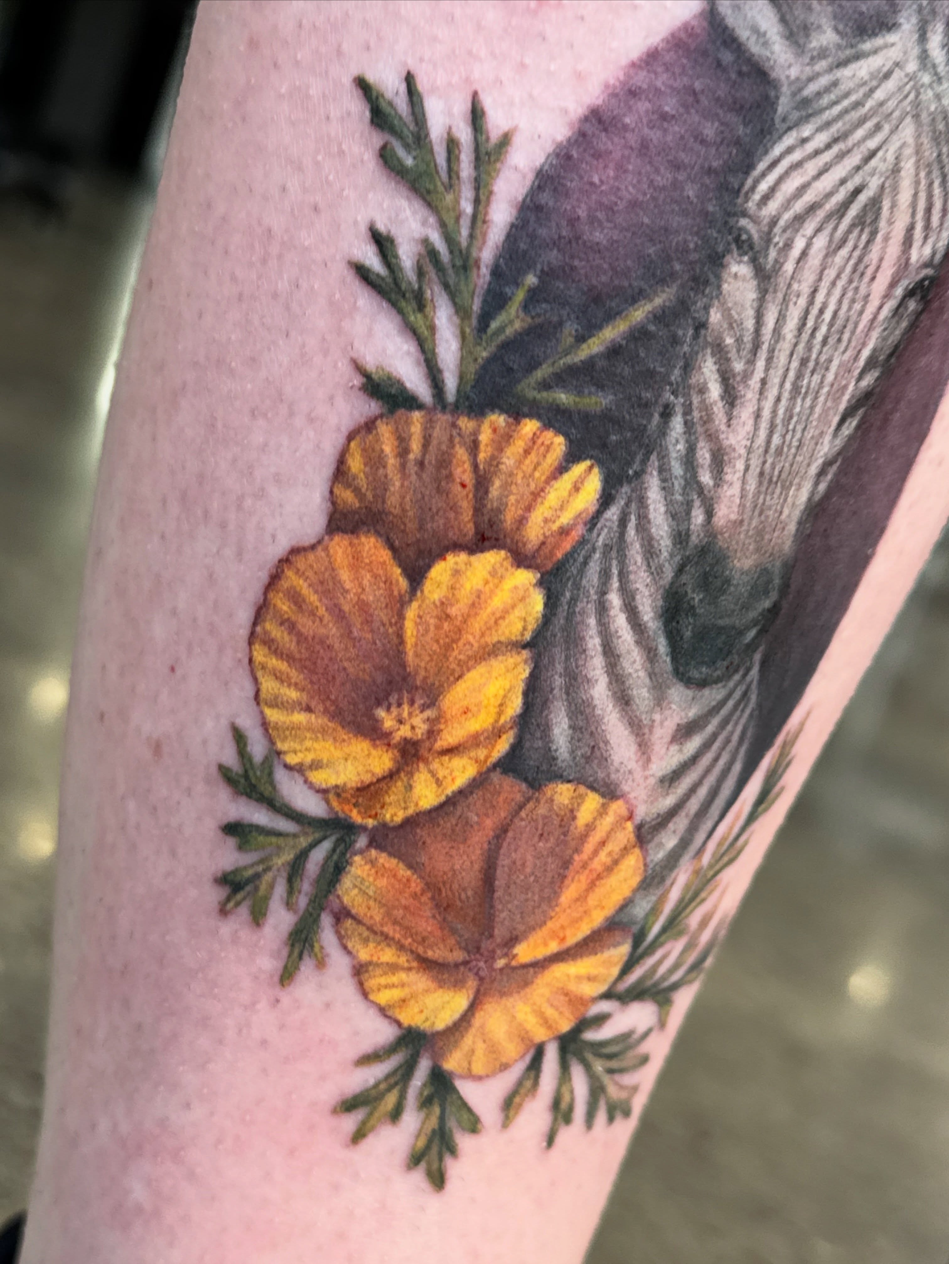 California poppies realism tattoo on the forearm by Glory Pechonis πΏ