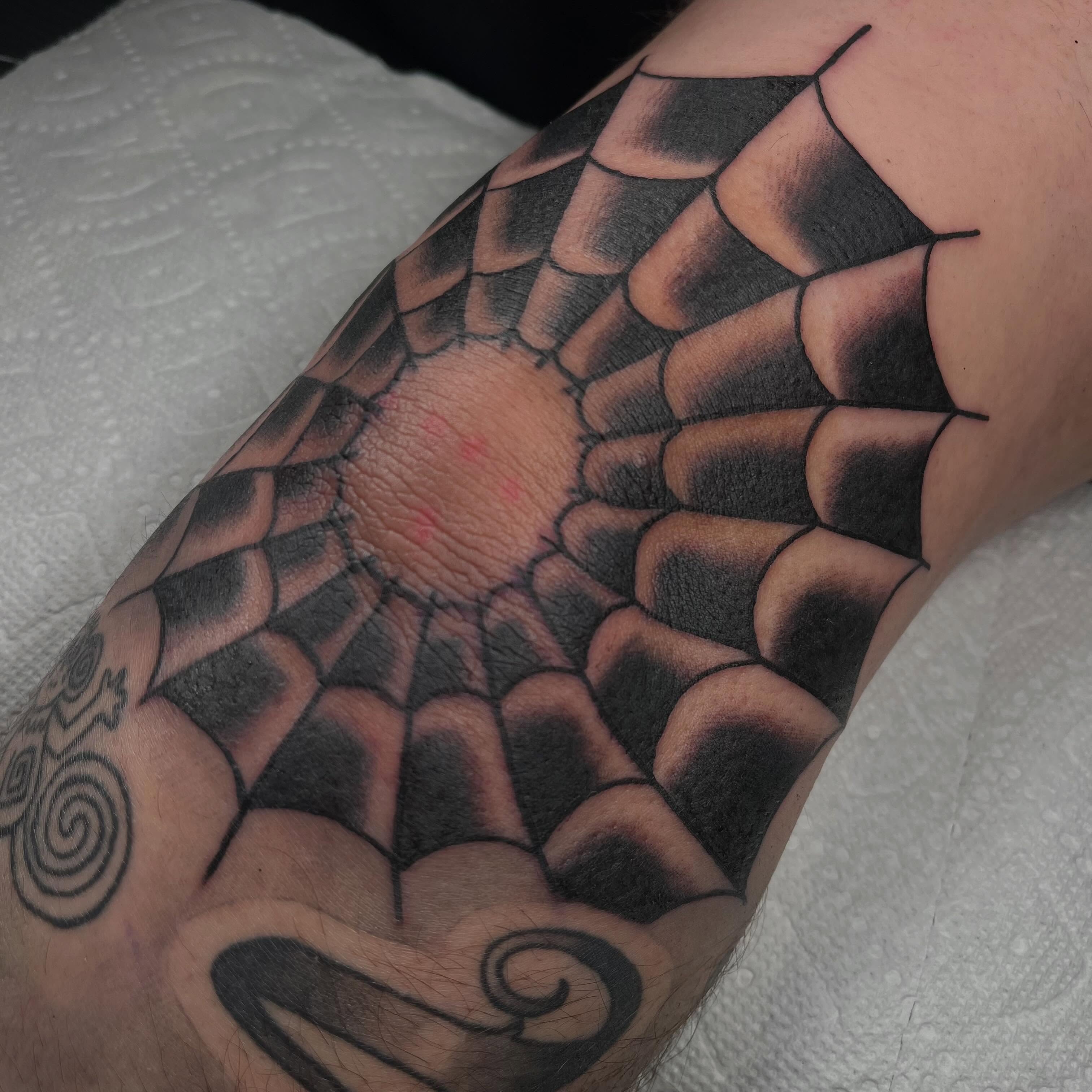 Dragon scales black and grey tattoo on the forearm by Jennifer Medrano
