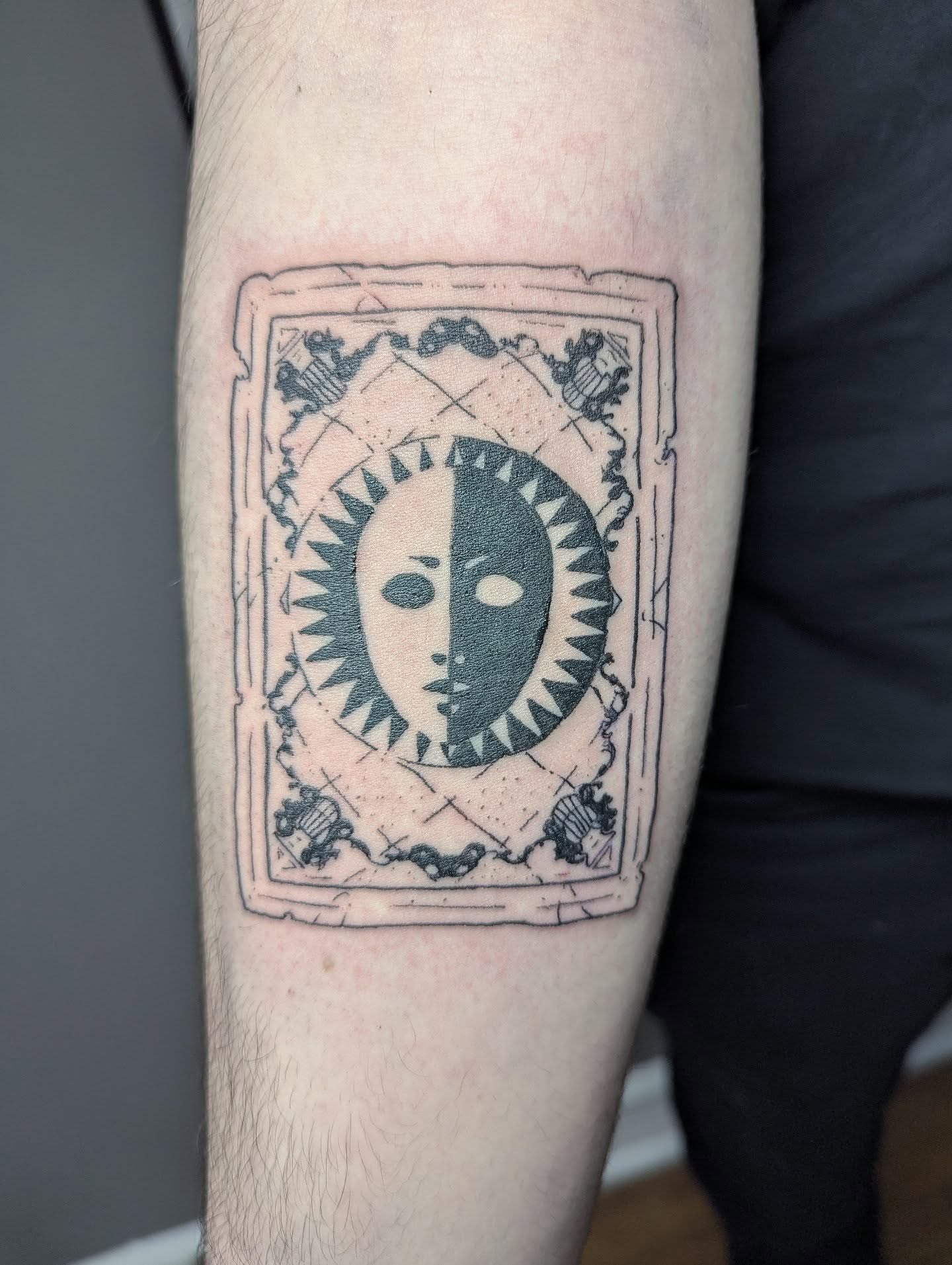 Split face black and grey tattoo on the forearm by Patricio