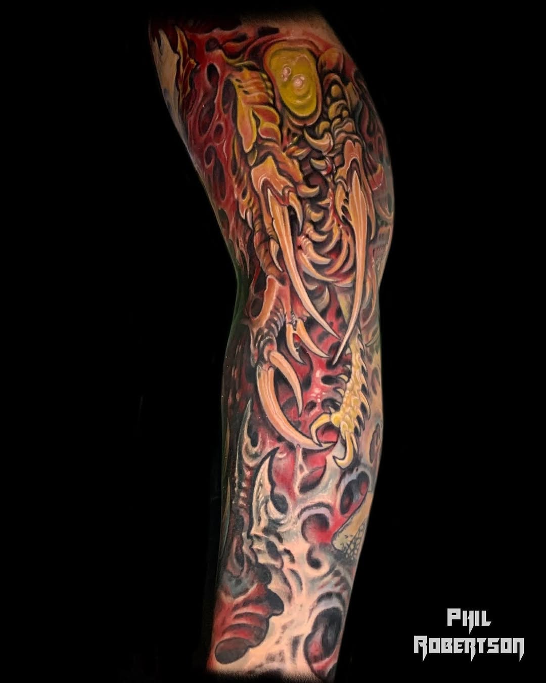 Biomechanical creature biomech tattoo on the forearm by Phil Robertson