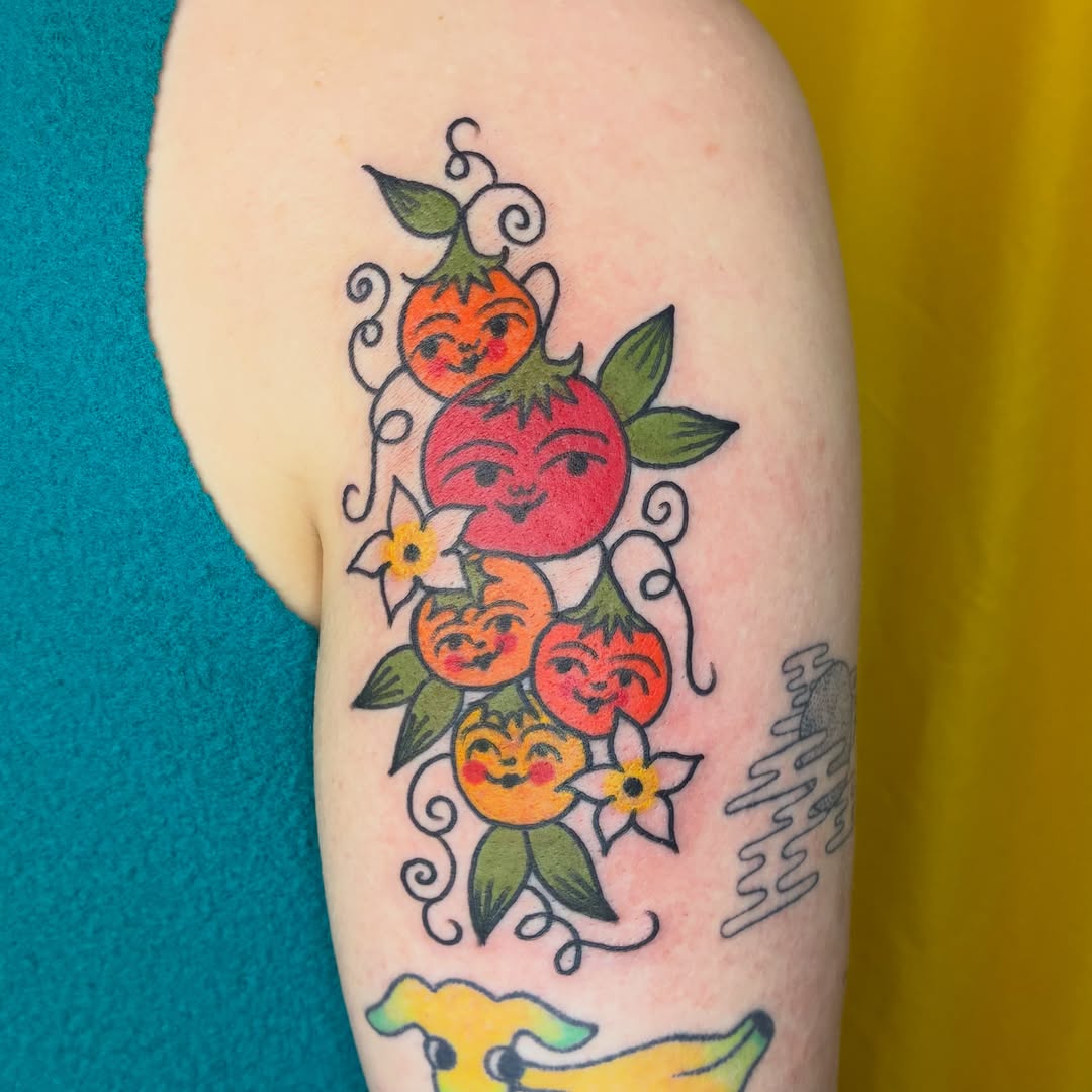 Fruits with faces American traditional tattoo on the forearm by Kaily McKee