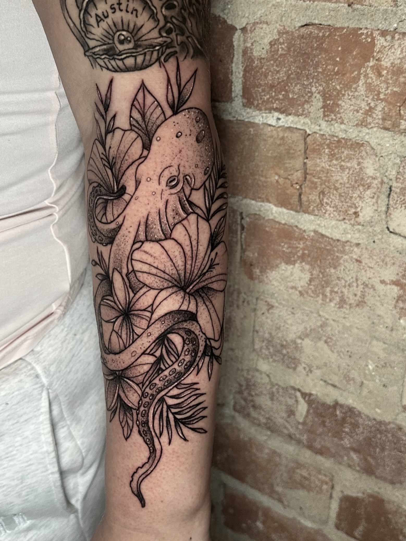 Octopus and floral dotwork tattoo on the forearm by E L I Z A H B e T H H D e S I G N S