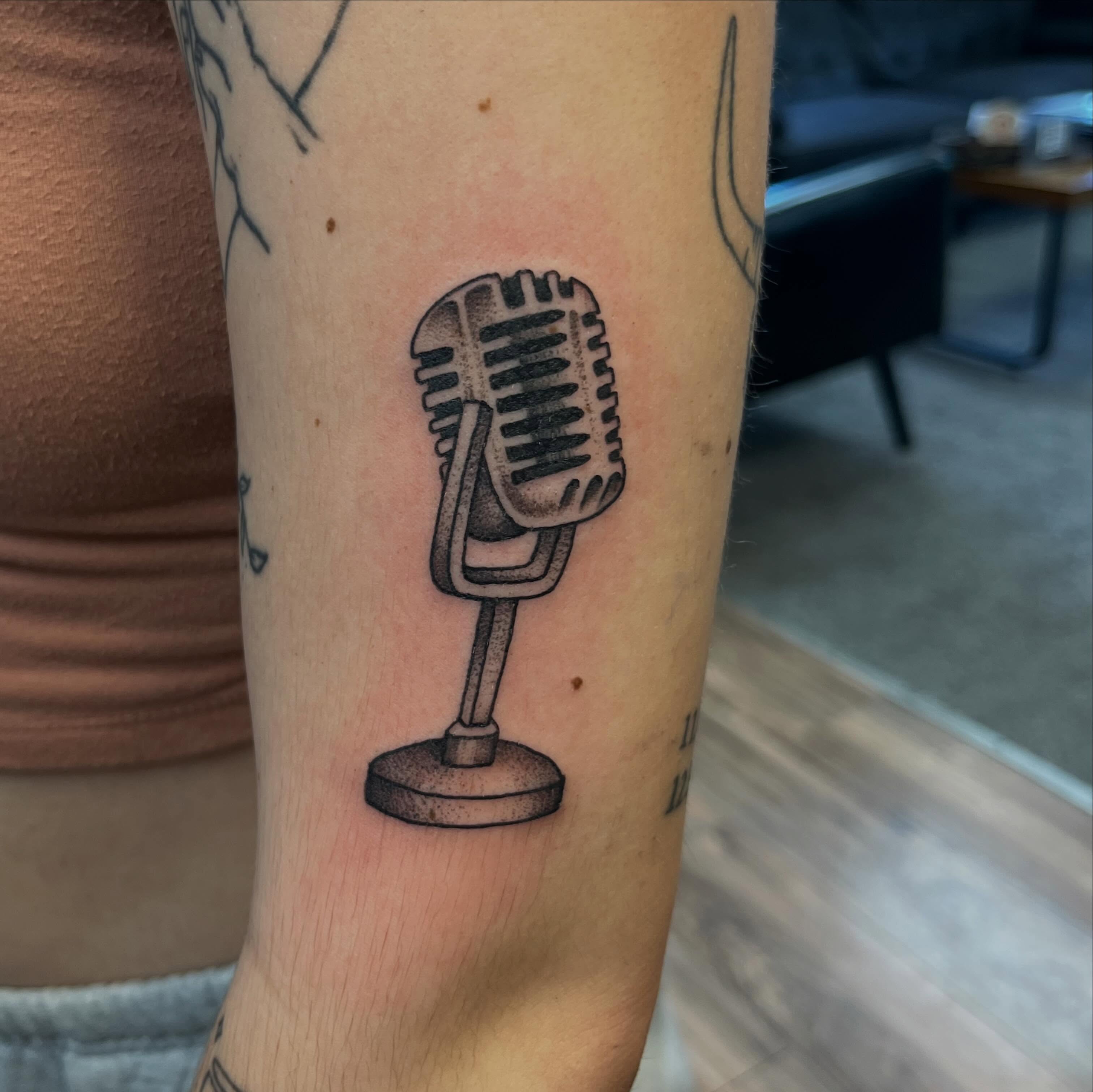 Microphone dotwork tattoo on the forearm by Danielle Lorandeau