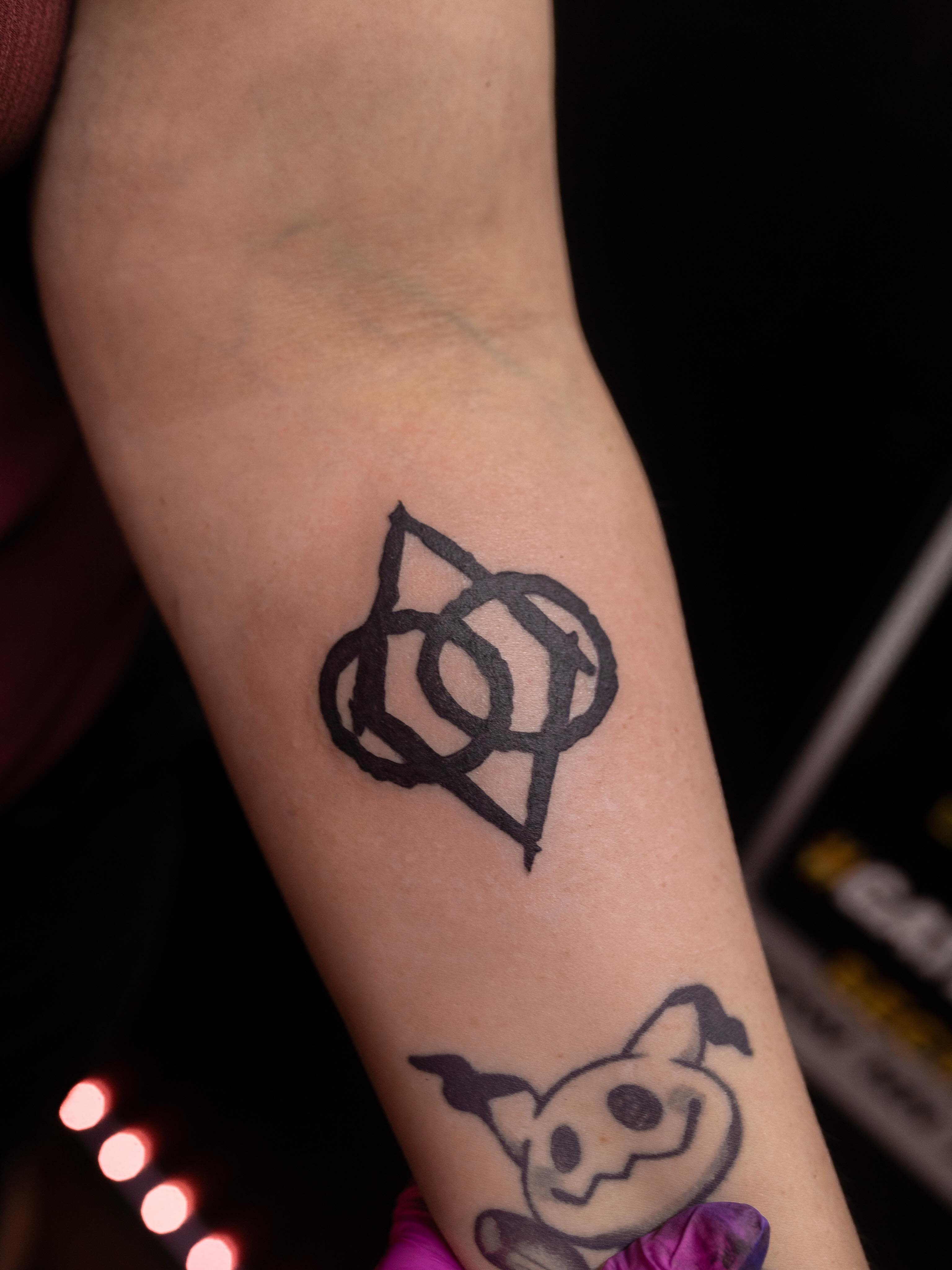 Geometric symbol geometric tattoo on the forearm by Kelsie