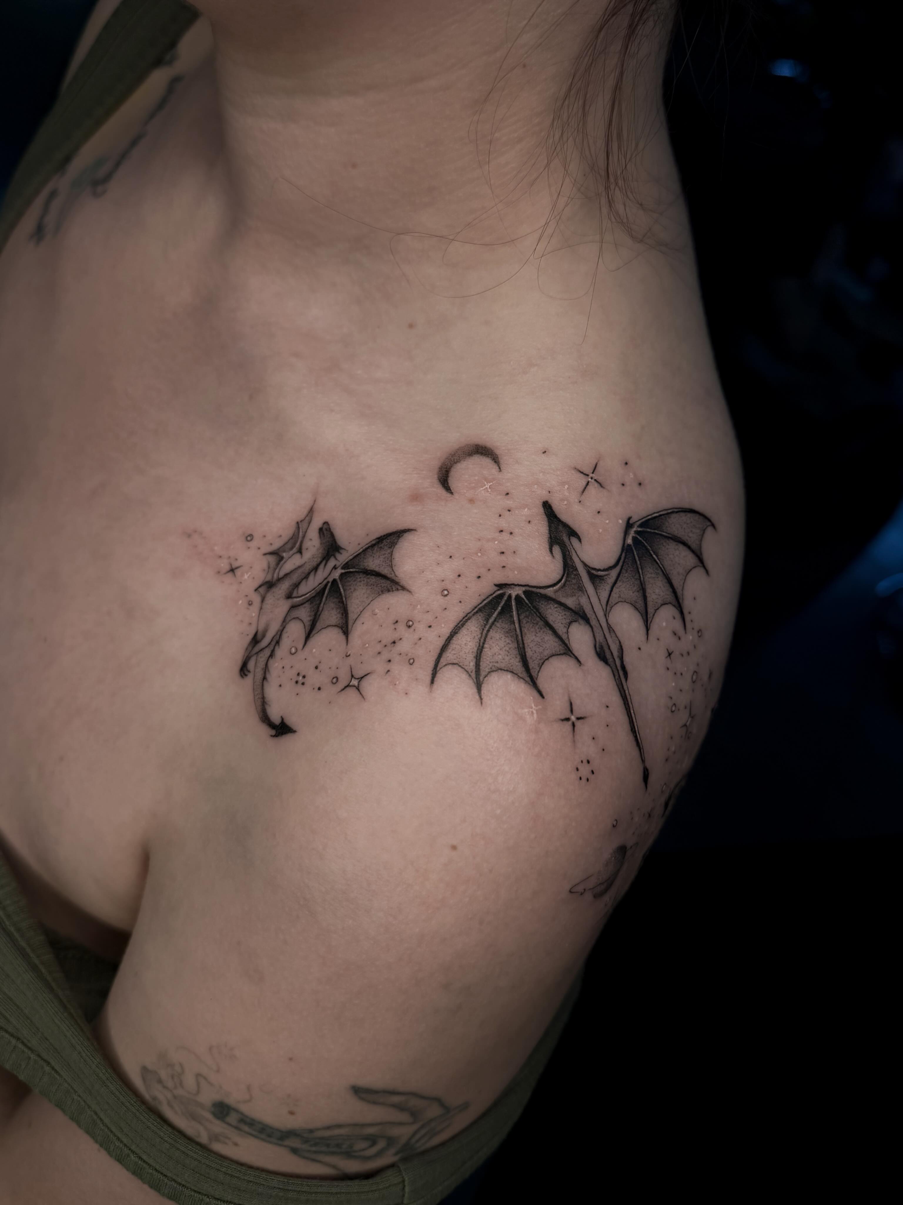 Bat wings dotwork tattoo on the chest by Susie Maj