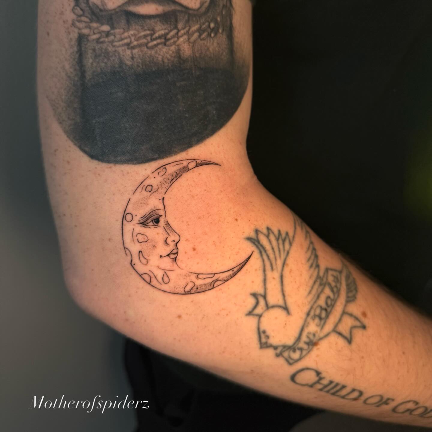 Moon with face black and grey tattoo on the forearm by Alyssa Garza
