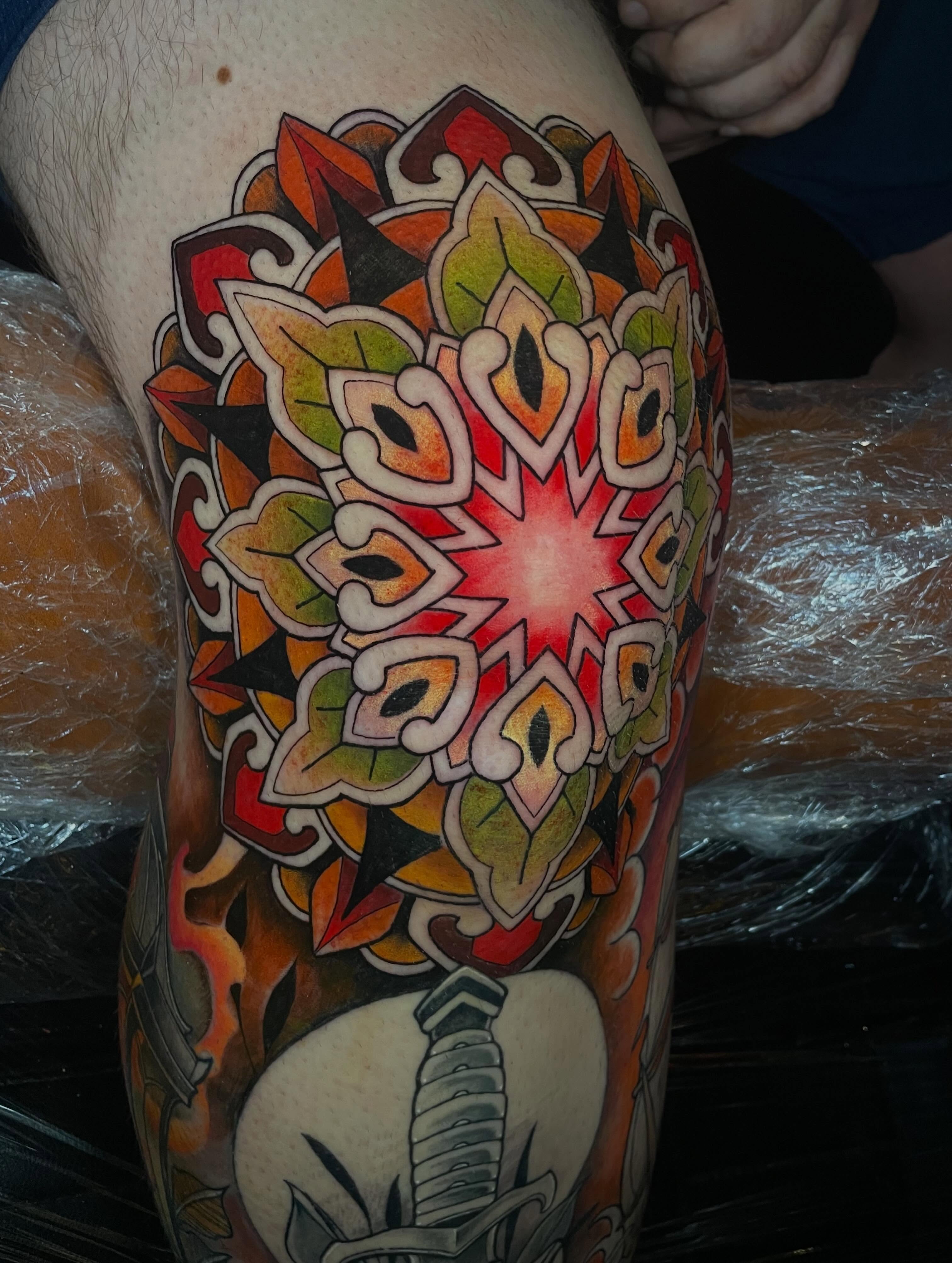 Mandala geometric tattoo on the thigh by Lauren Sisouphanh, Canton, Ohio