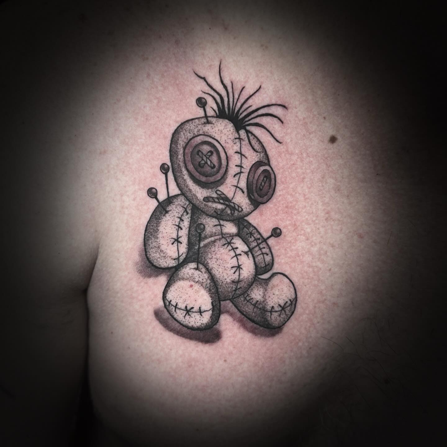 Voodoo doll dotwork tattoo on the chest by Kelsea Weir McCree