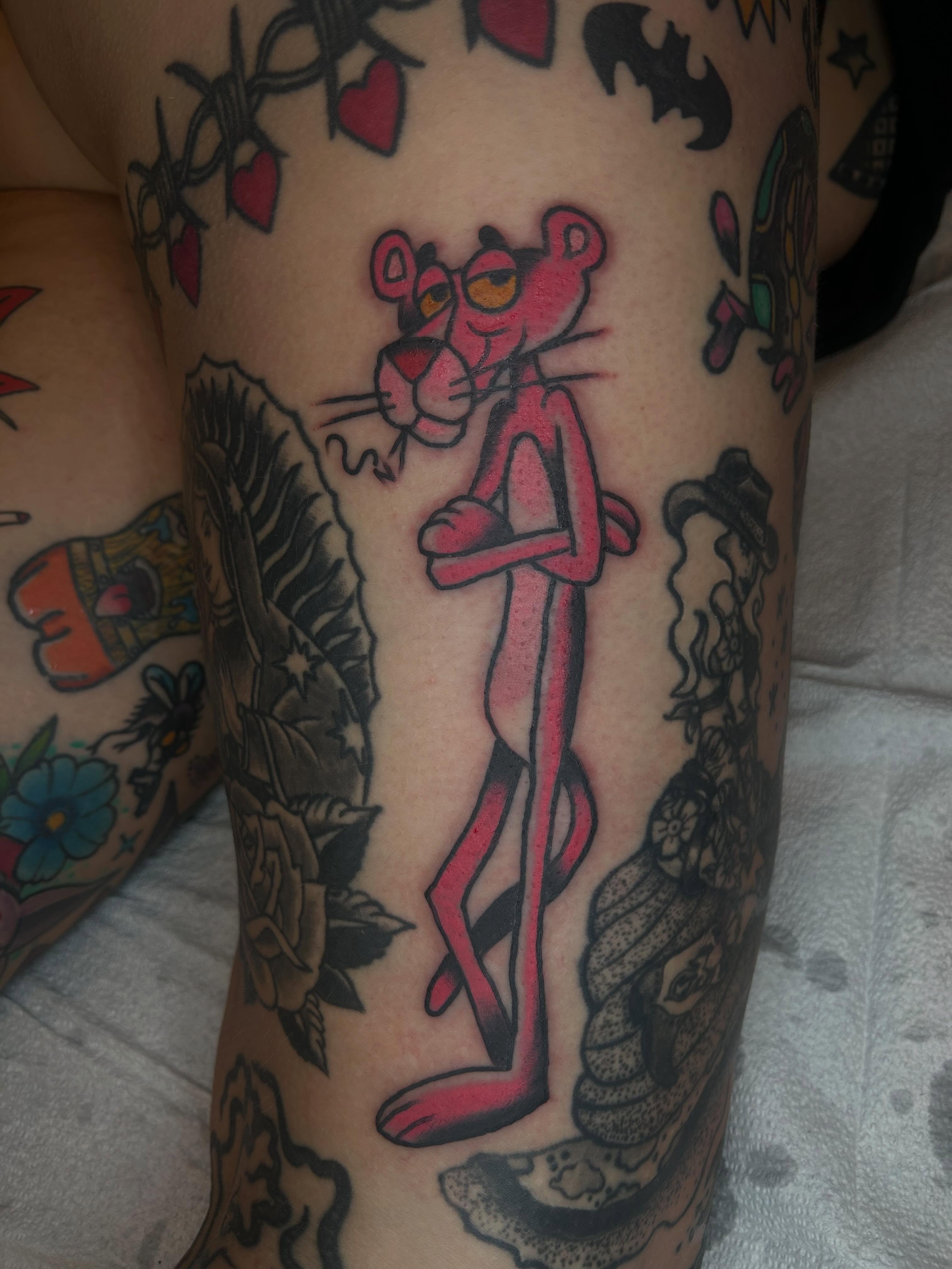 Pink panther American traditional tattoo on the forearm by Casey Lewis - Tattoo Artist, Cleveland Ohio