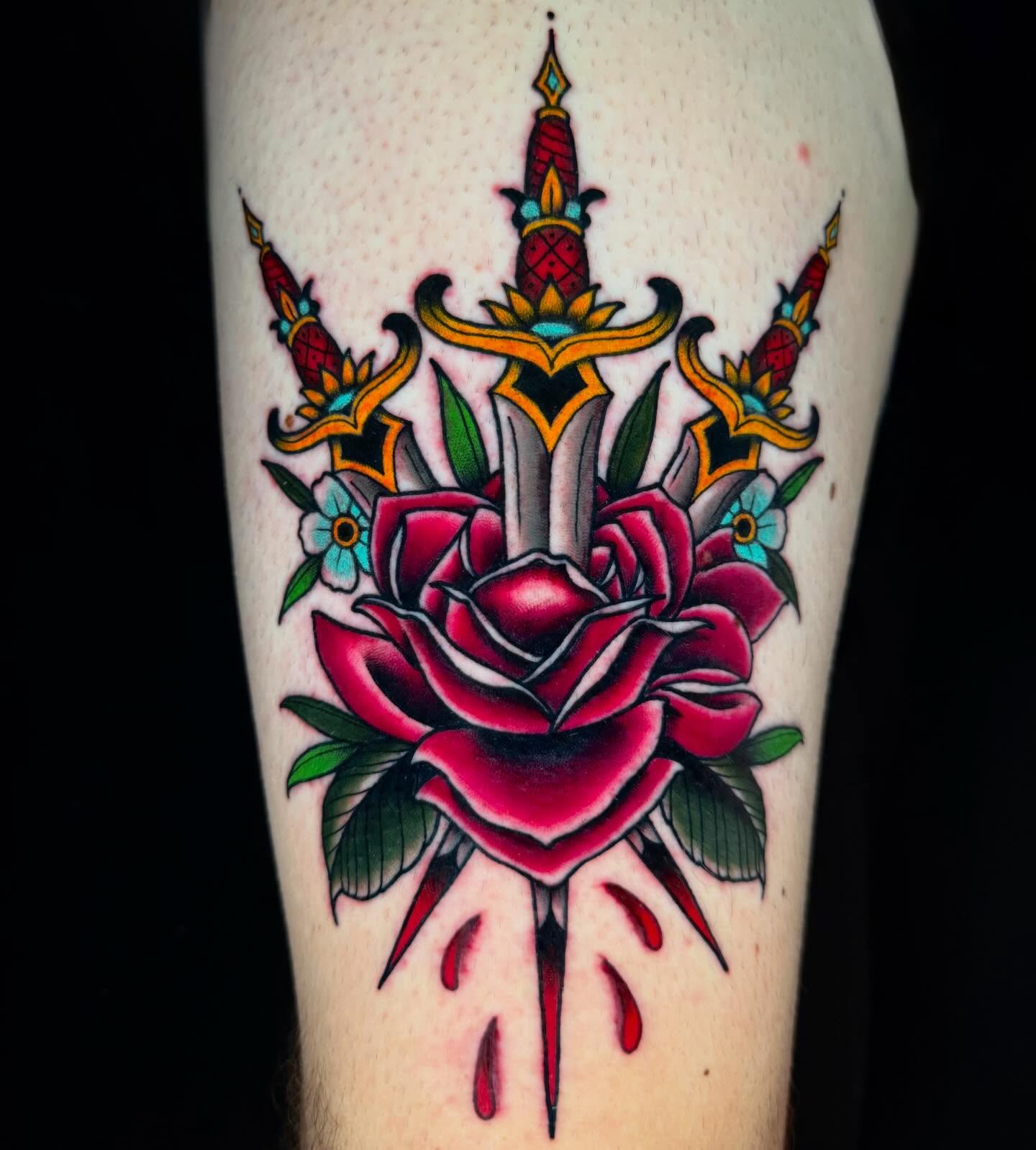 Rose and dagger American traditional tattoo on the forearm by Trenton Helms