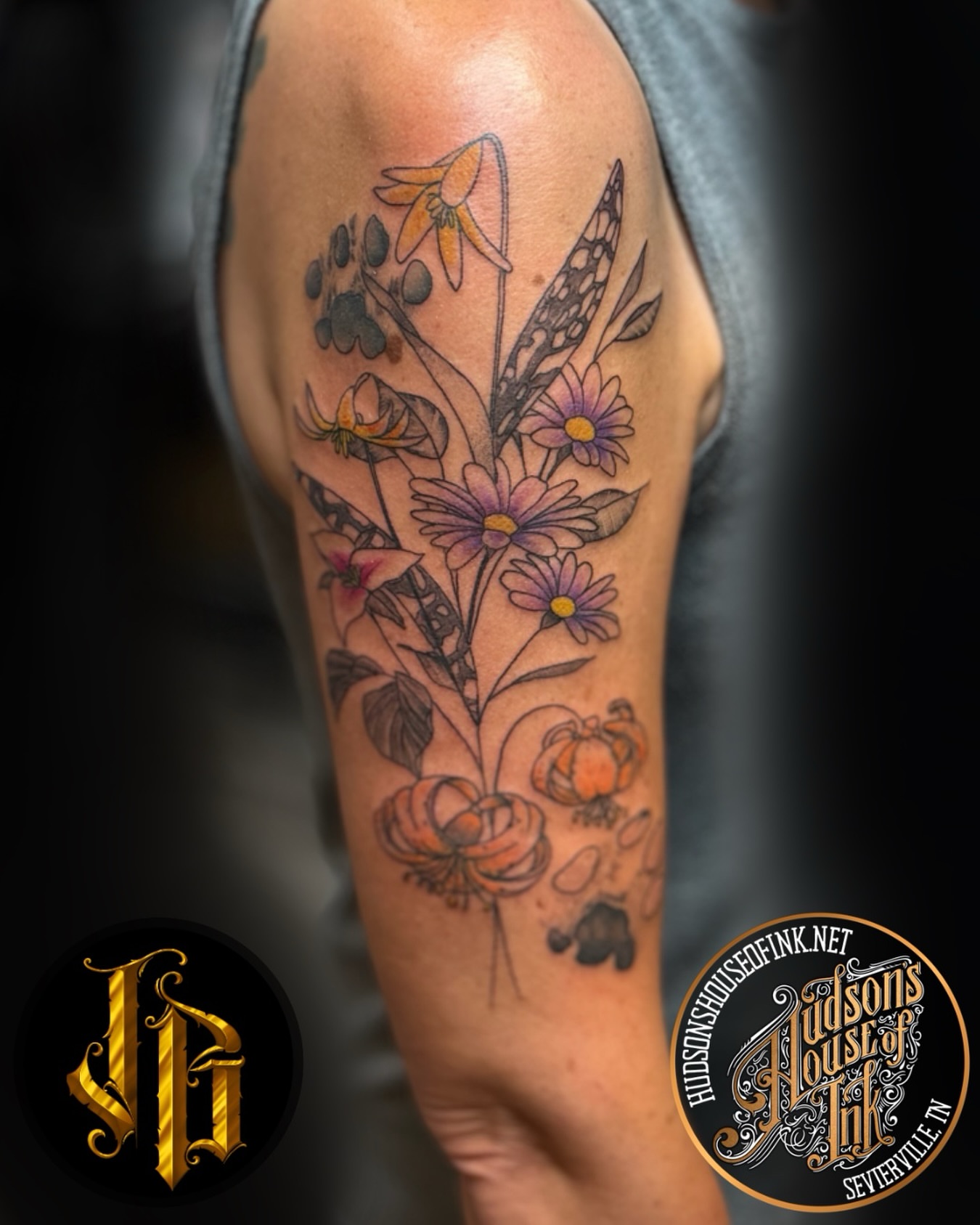Floral bouquet realism tattoo on the forearm by James Brooks