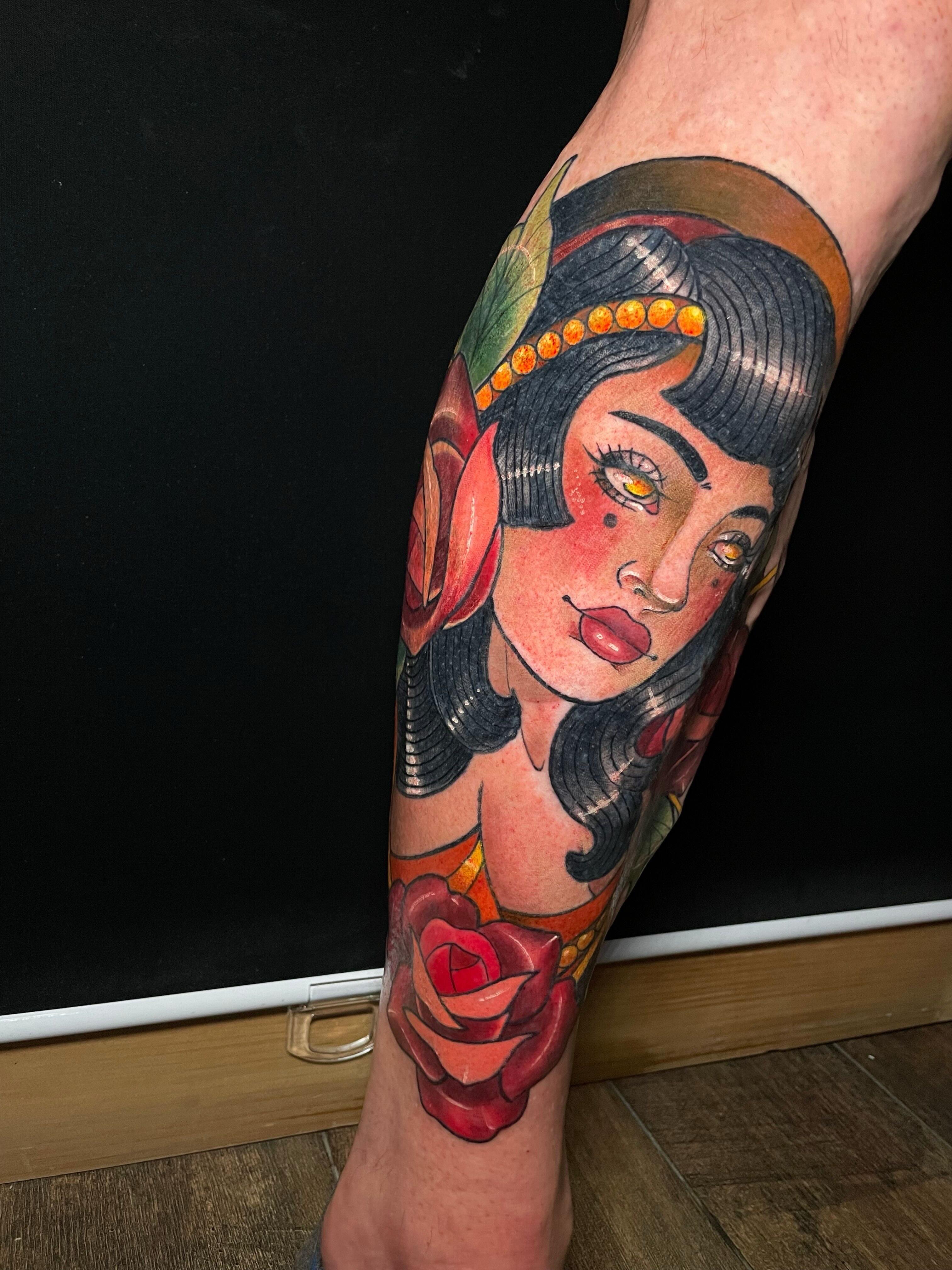 Woman with flower American traditional tattoo on the forearm by Tanya Murski