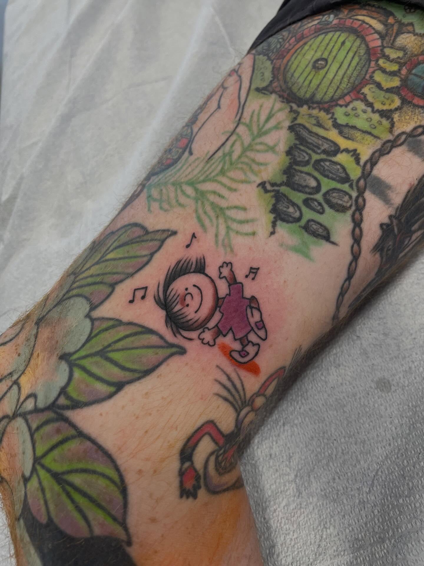 Child falling American traditional tattoo on the forearm by Fionna Fanning