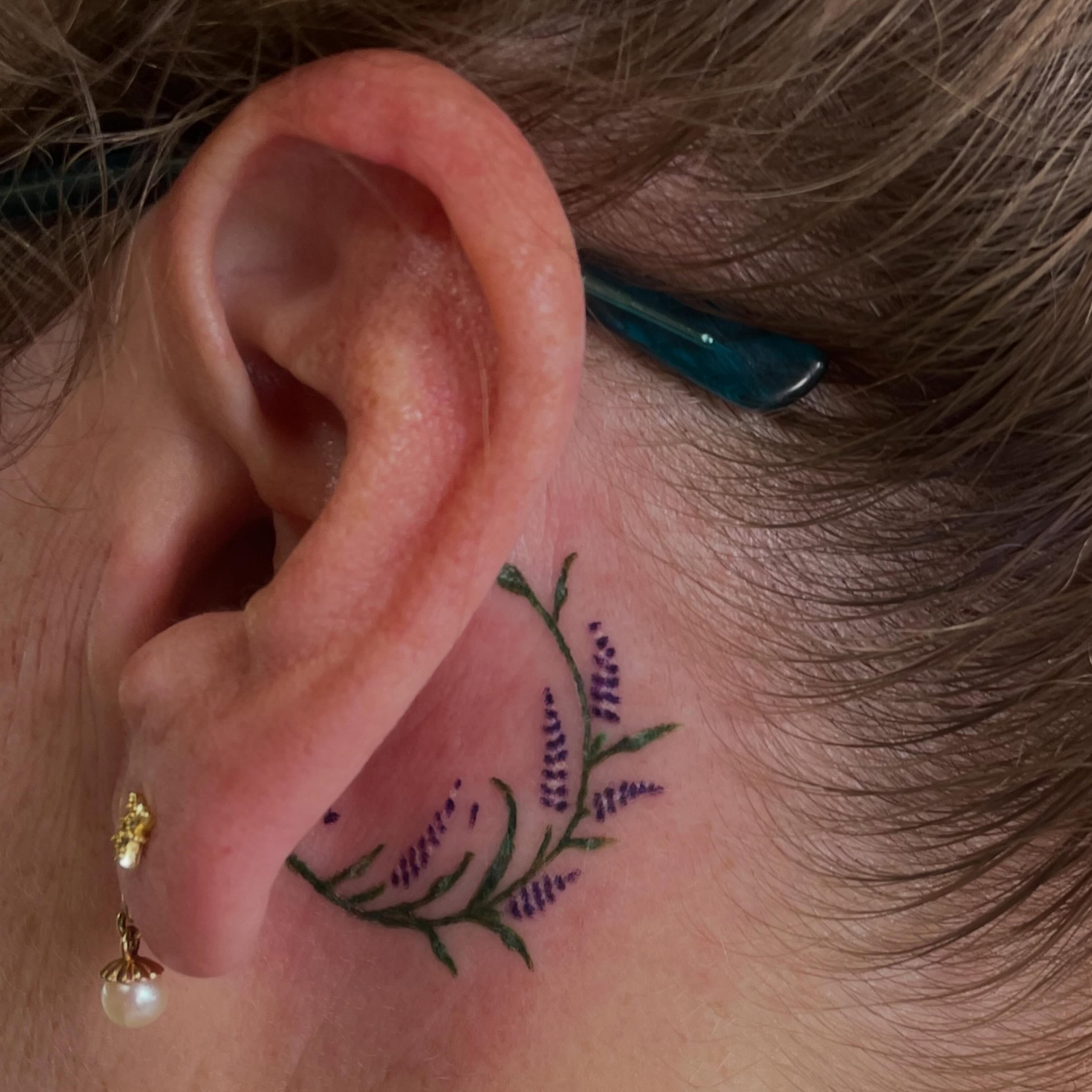 Lavender plant dotwork tattoo on the neck by Avalon Sable