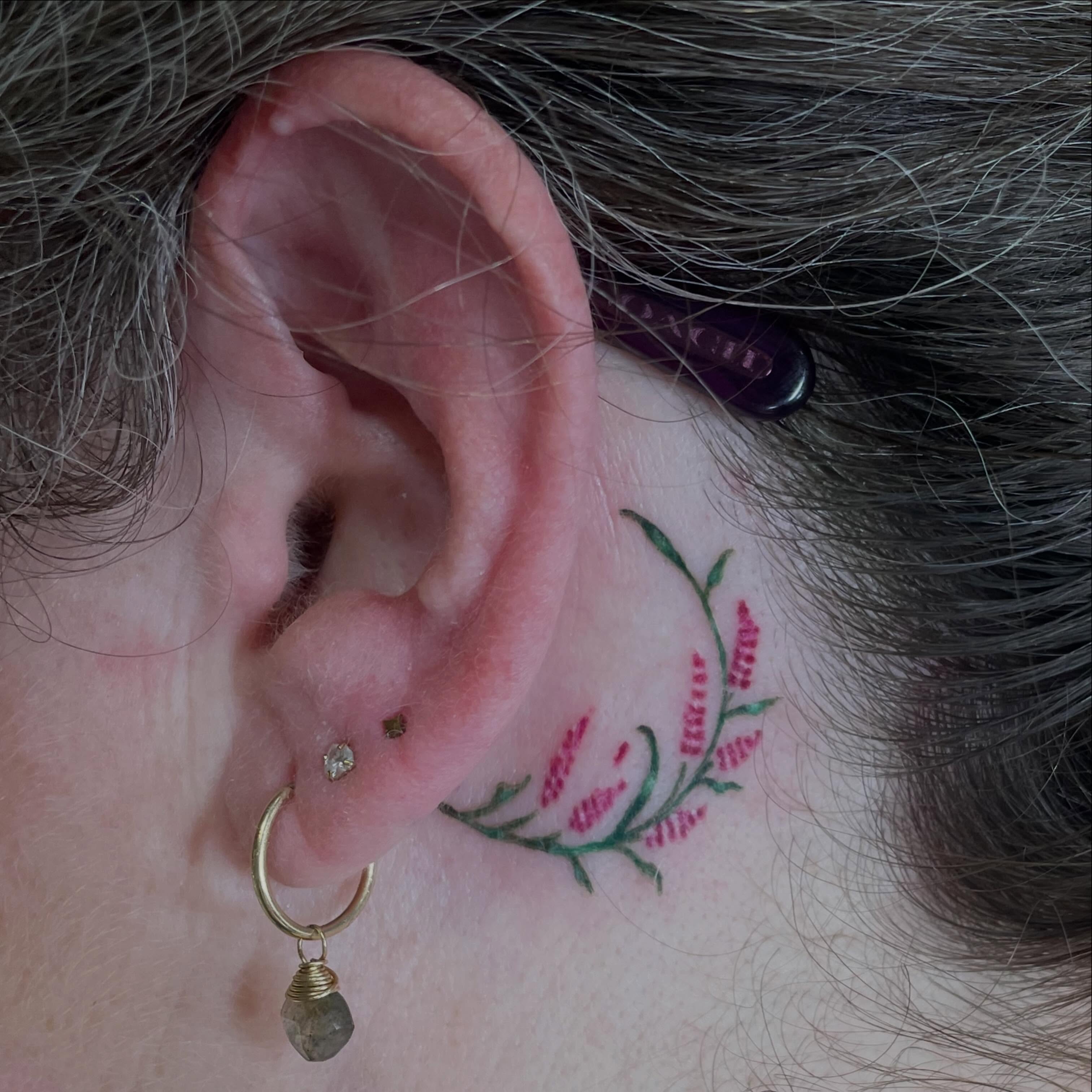 Floral vine dotwork tattoo on the neck by Avalon Sable