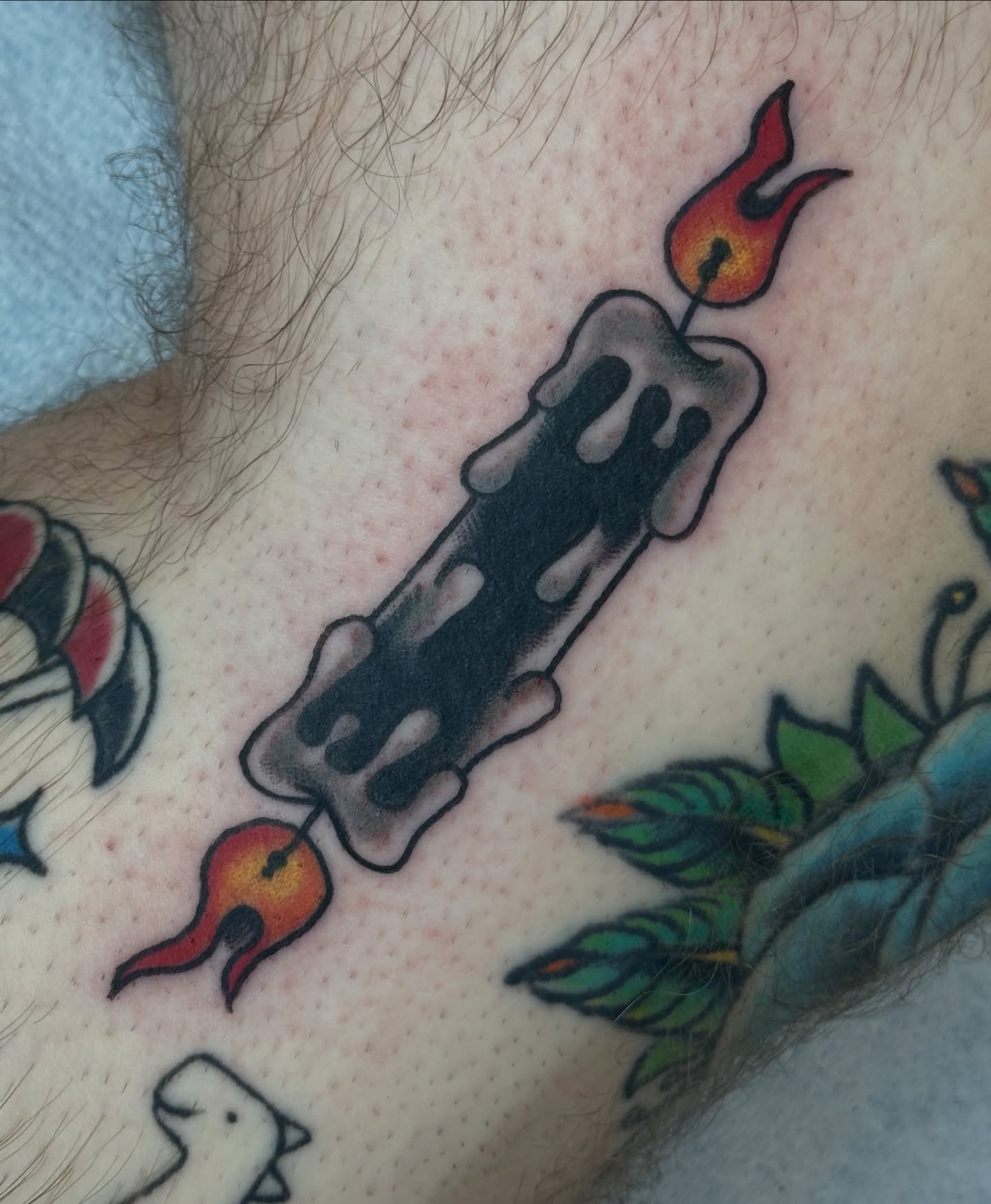 Burning candle American traditional tattoo on the chest by julian solis, Houston, Texas
