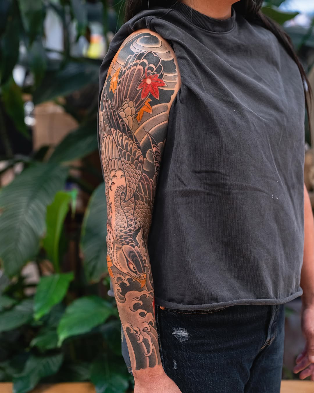 Eagle and waves Japanese tattoo on the upper arm by Matt Leibo, San Francisco, California
