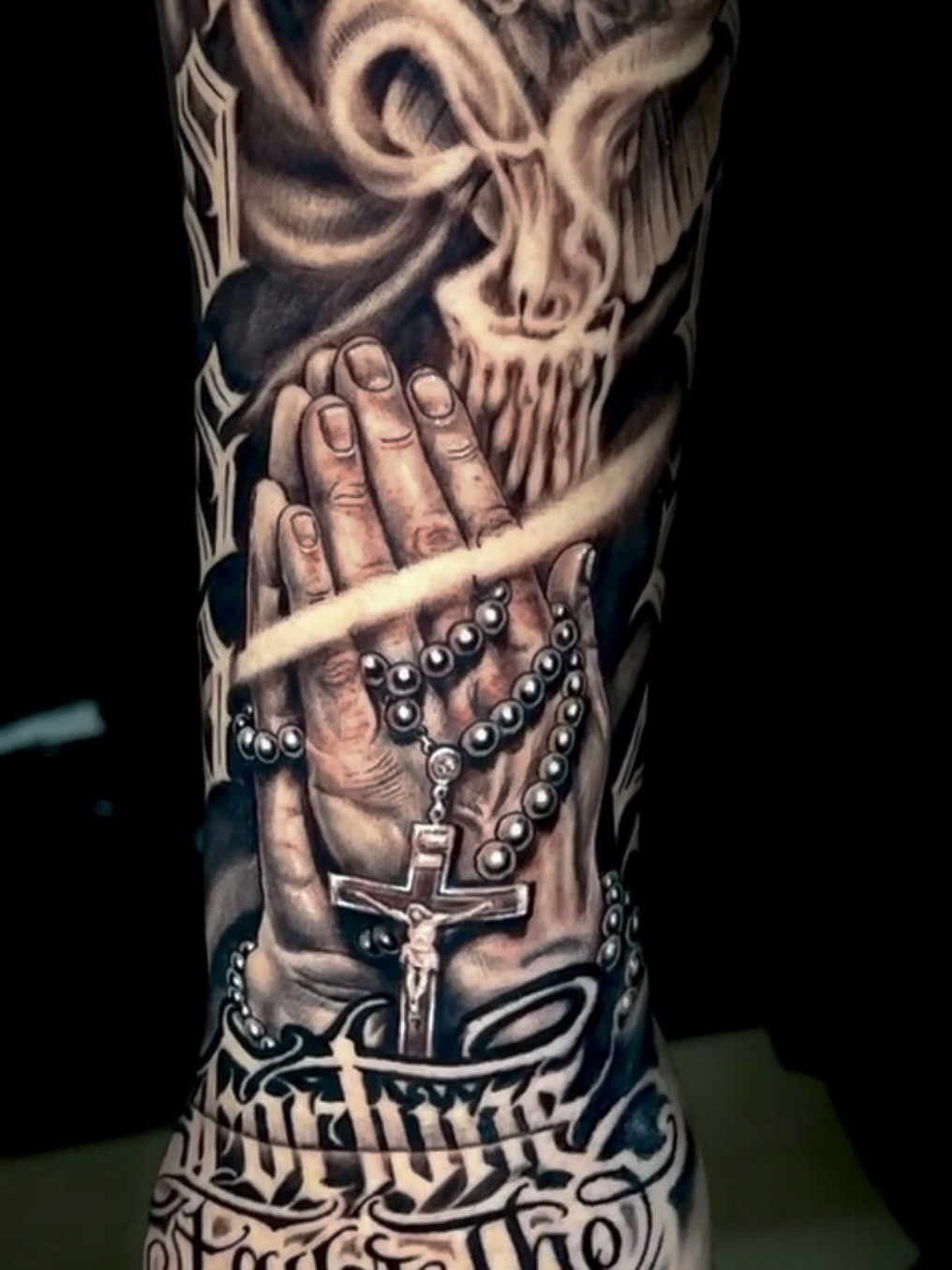 Praying hands with rosary realism tattoo on the forearm by Omar Sheriff Herrera