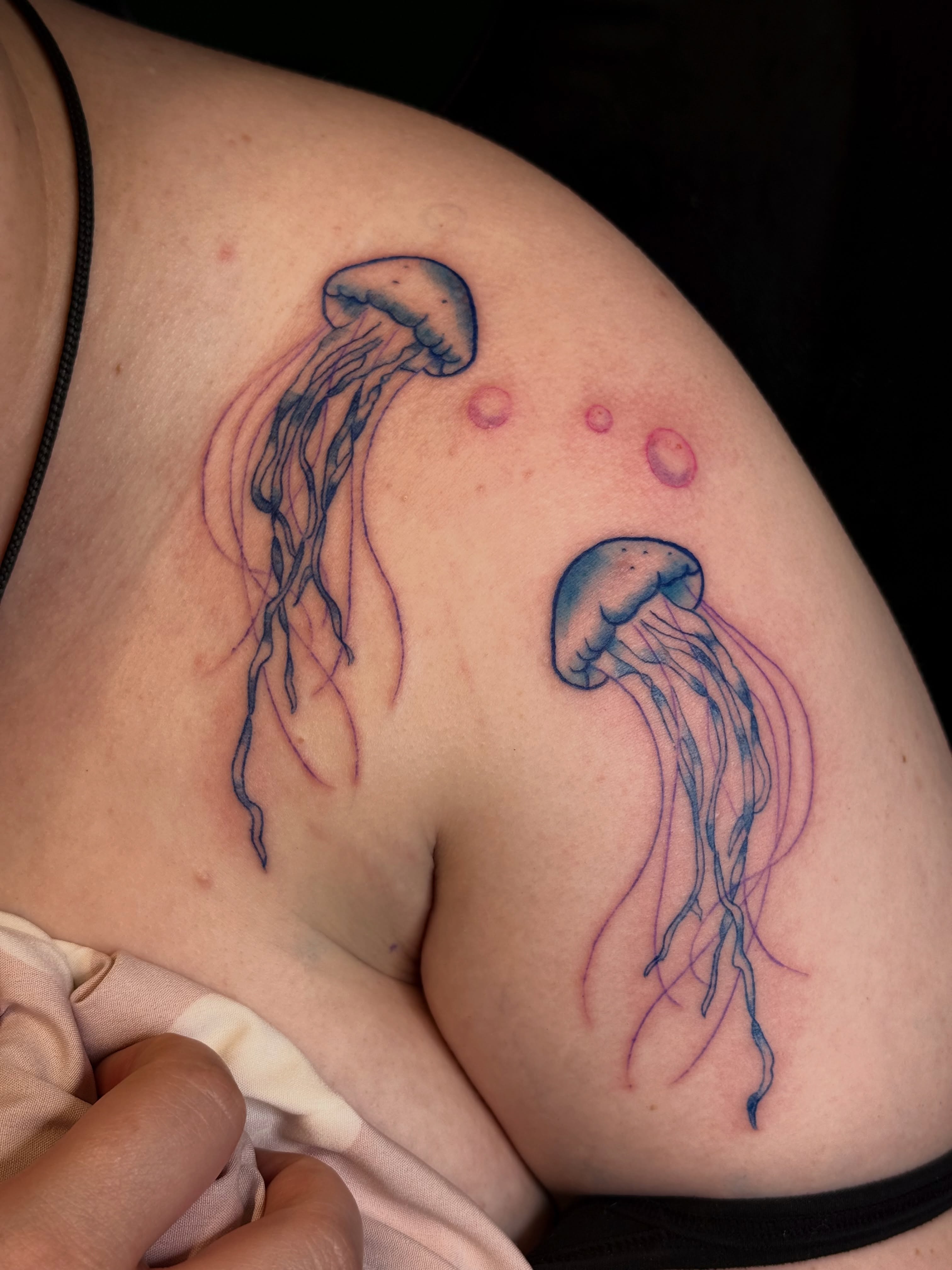 Jellyfish realism tattoo on the shoulder by Jennifer Contreras