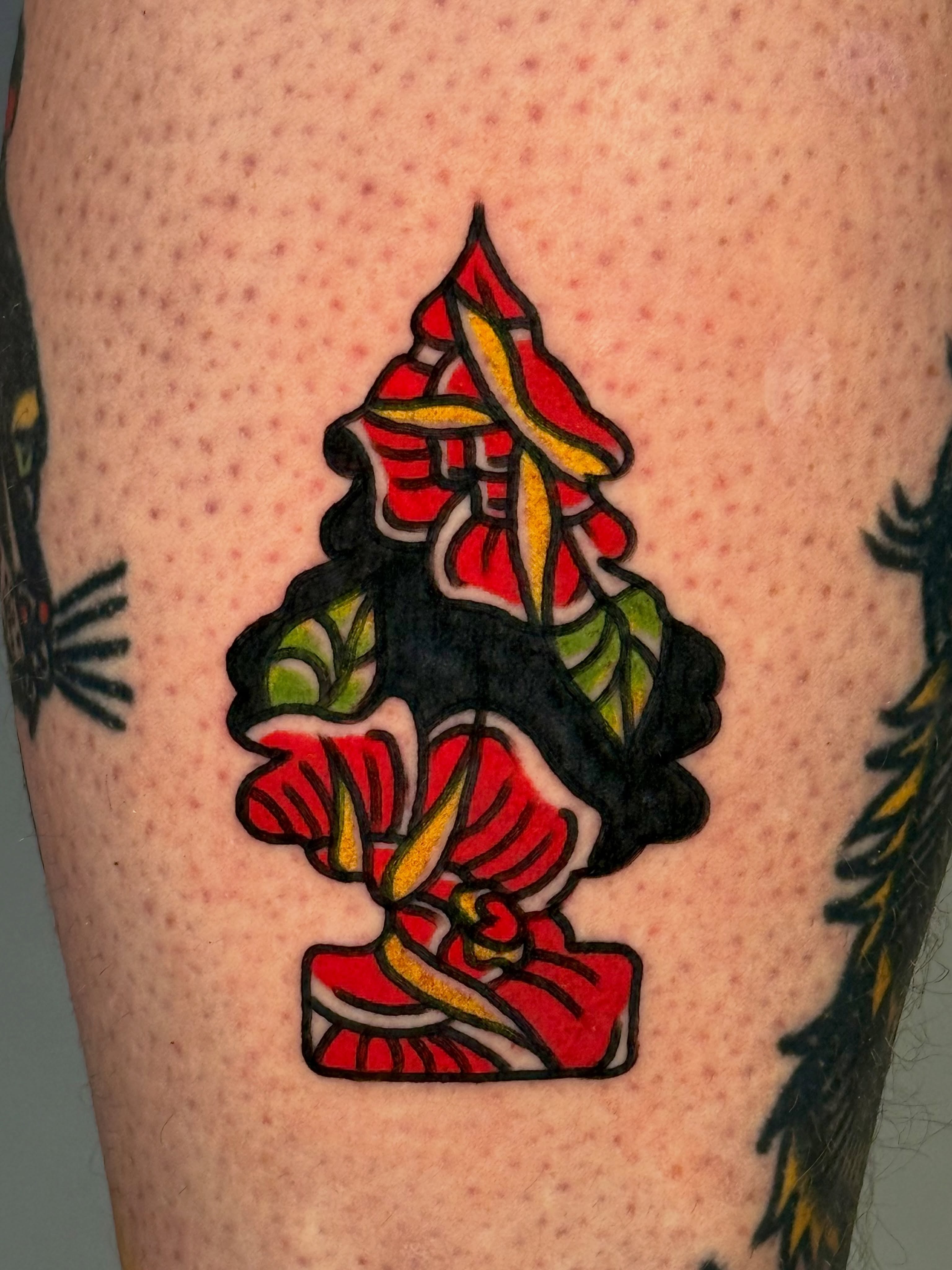 Red flowers American traditional tattoo on the forearm by Tattooer Sancho 🇰🇷🇨🇦