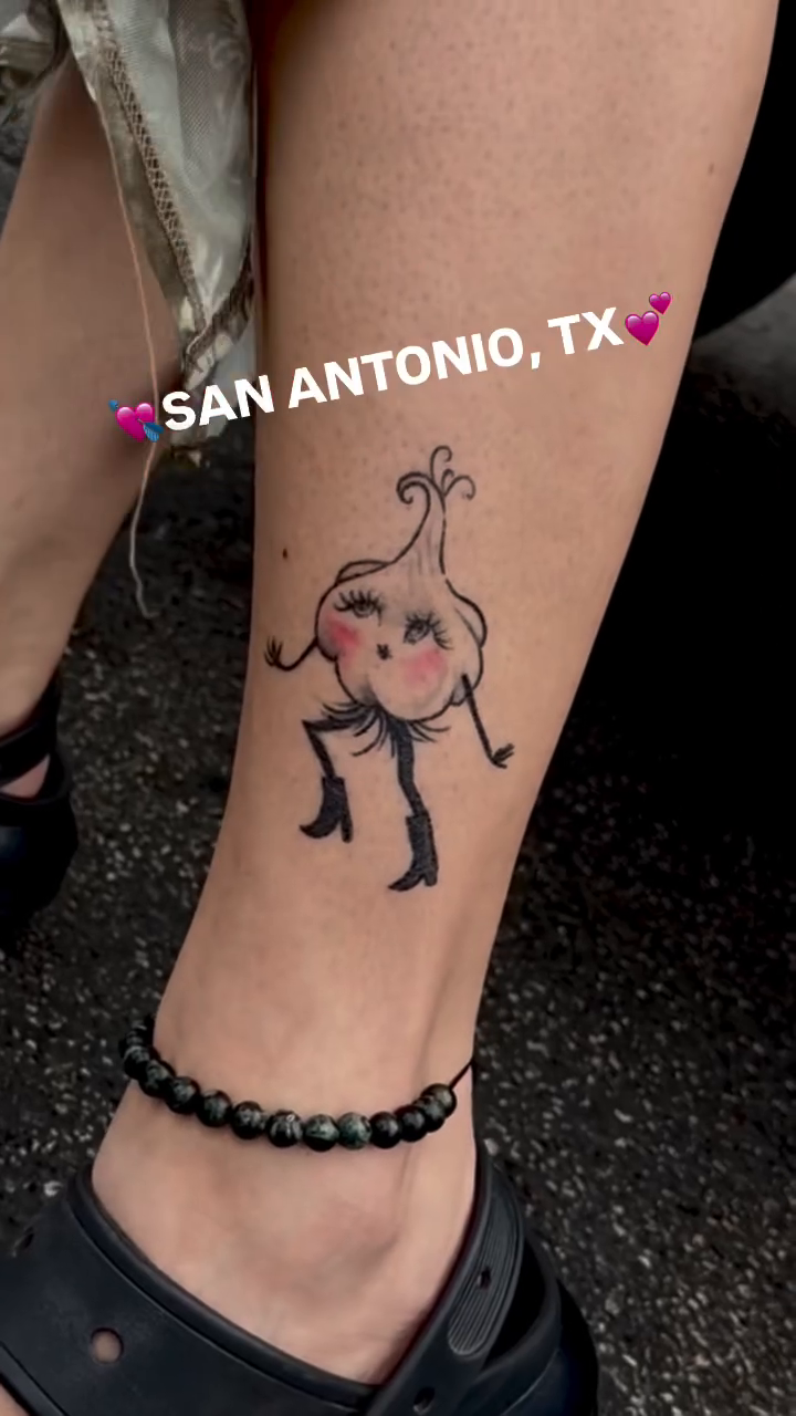 Dancing garlic character minimalist tattoo on the leg by tattooz by megz
