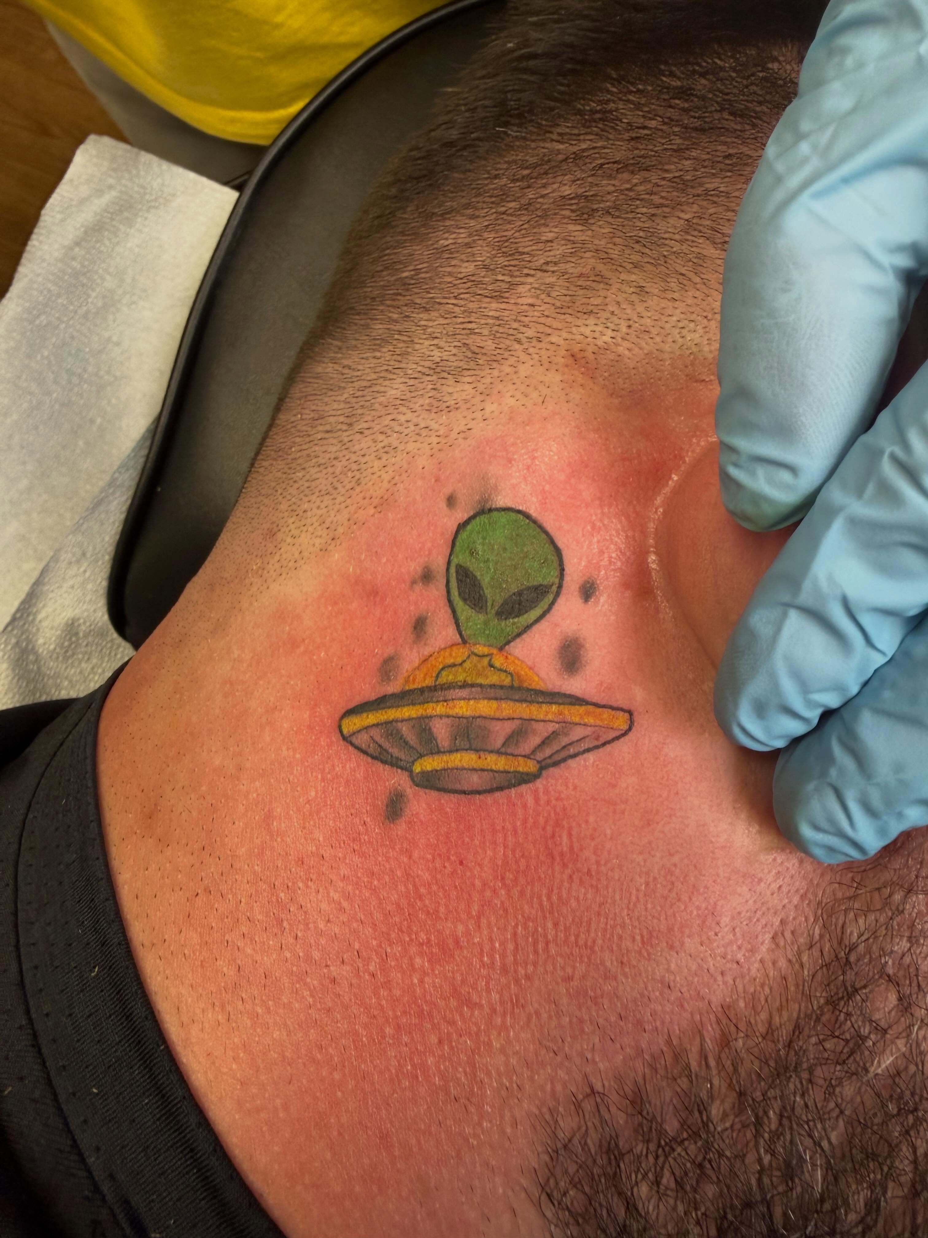 Alien abduction new school tattoo on the shoulder by Shane Fowler, Massillon, Ohio