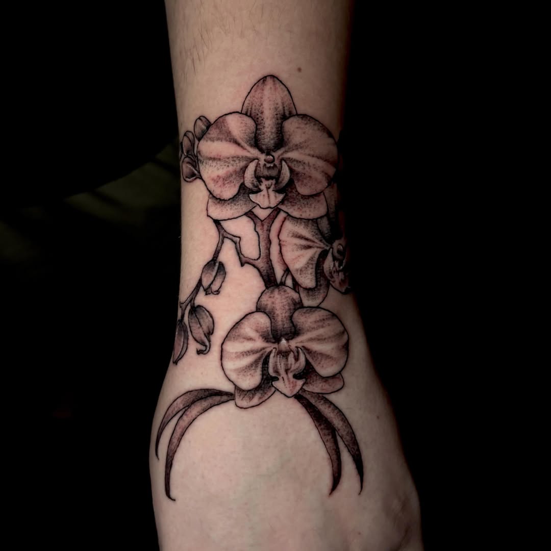 Orchid dotwork tattoo on the forearm by Lee