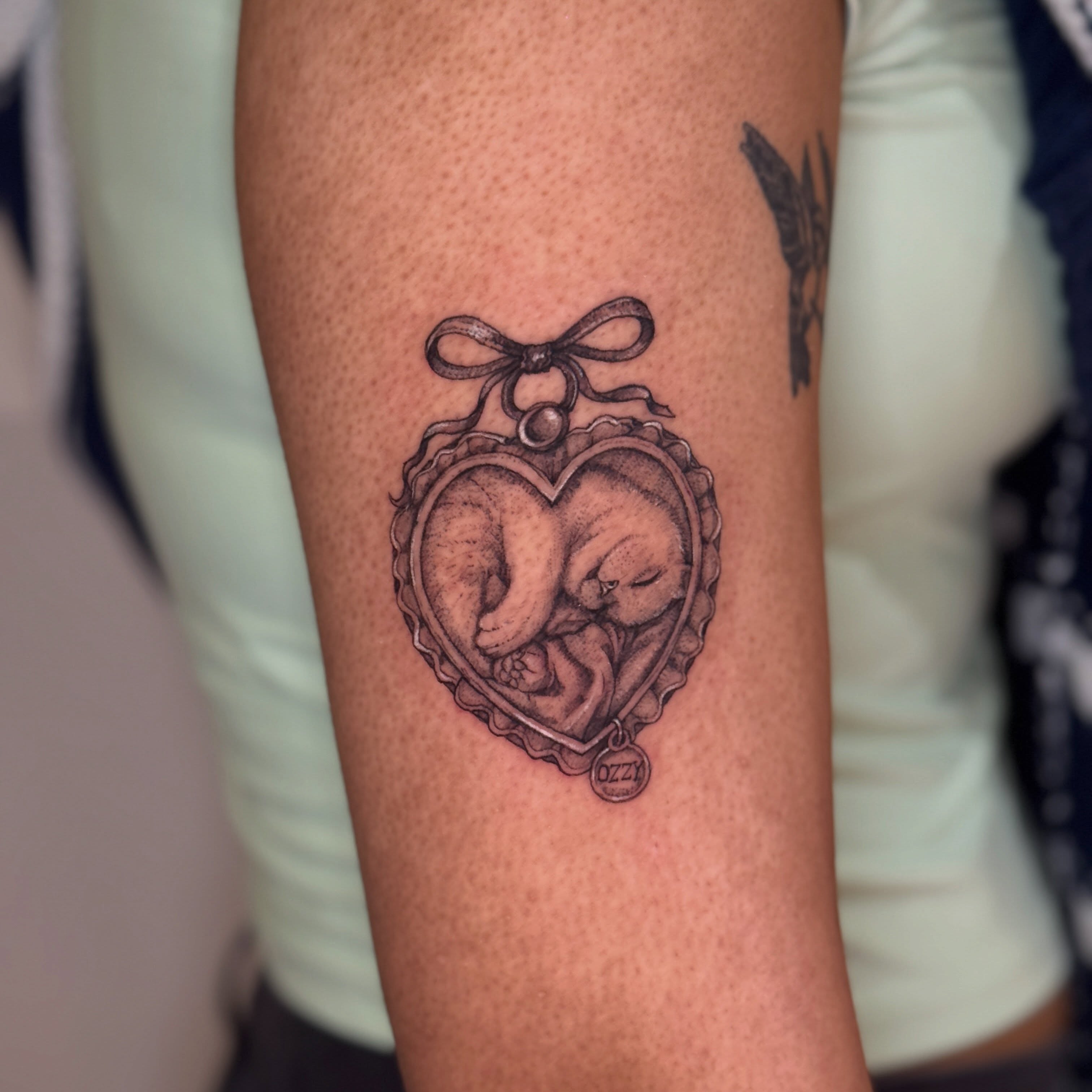 Fetus in heart black and grey tattoo on the forearm by ink by kimmy ☾⋆⁺₊⋆