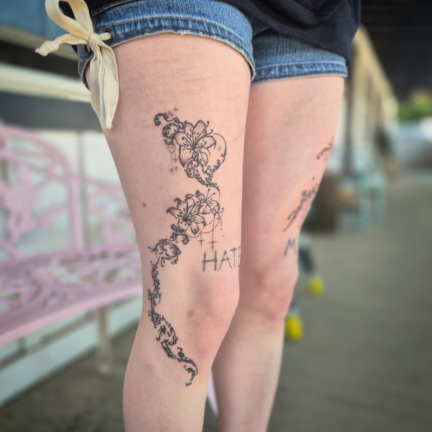 Lily and butterfly black and grey tattoo on the thigh by π΅ππππ§π»ββοΈβΛκ©ο½‘β