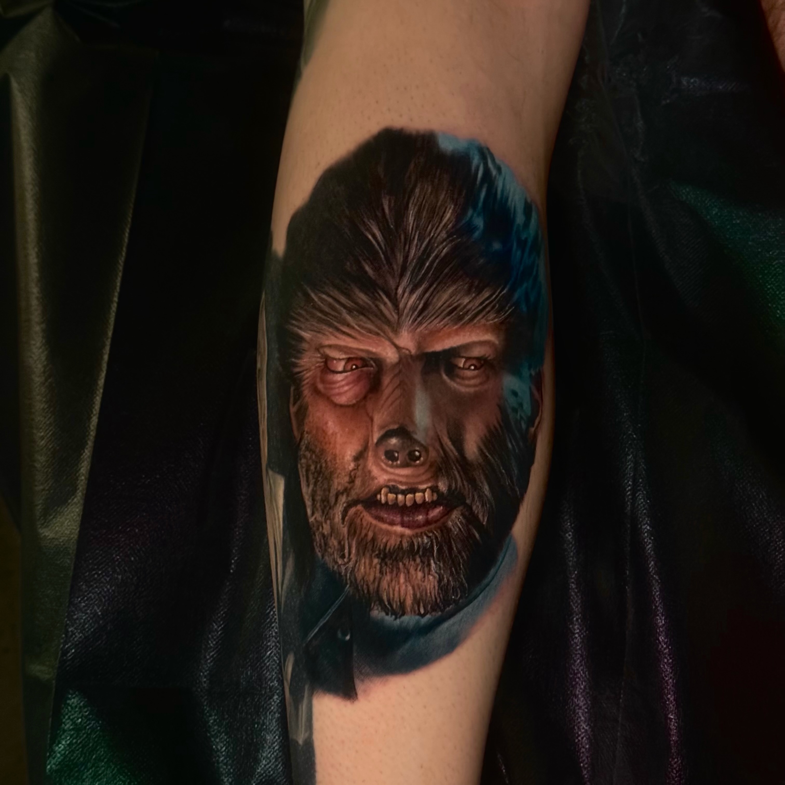 Man's face realism tattoo on the forearm by Edward best