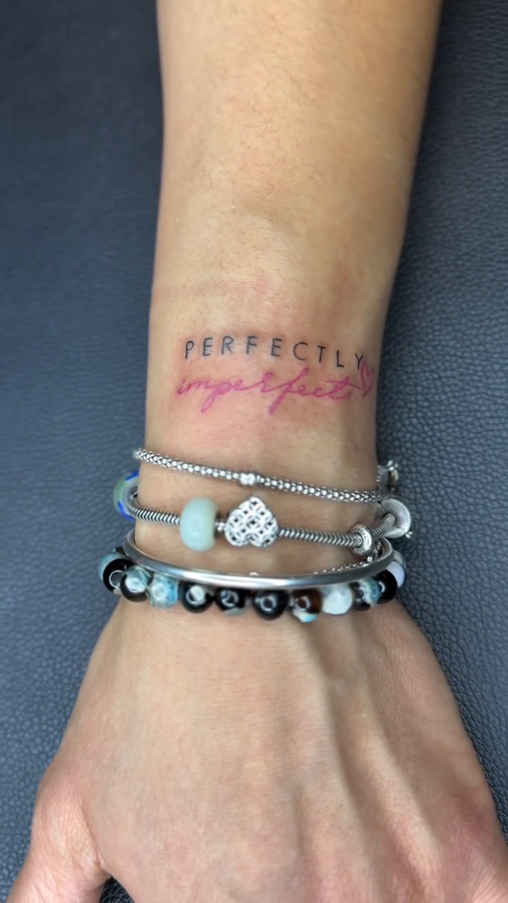 Perfectly Imperfect text tattoo lettering tattoo on the forearm by Jazz Walker