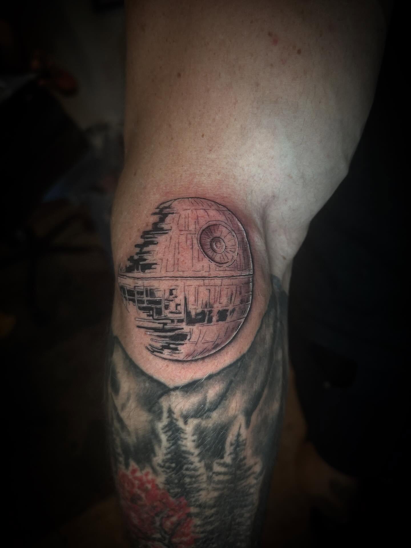 Death Star black and grey tattoo on the forearm by Gabrielle Mack