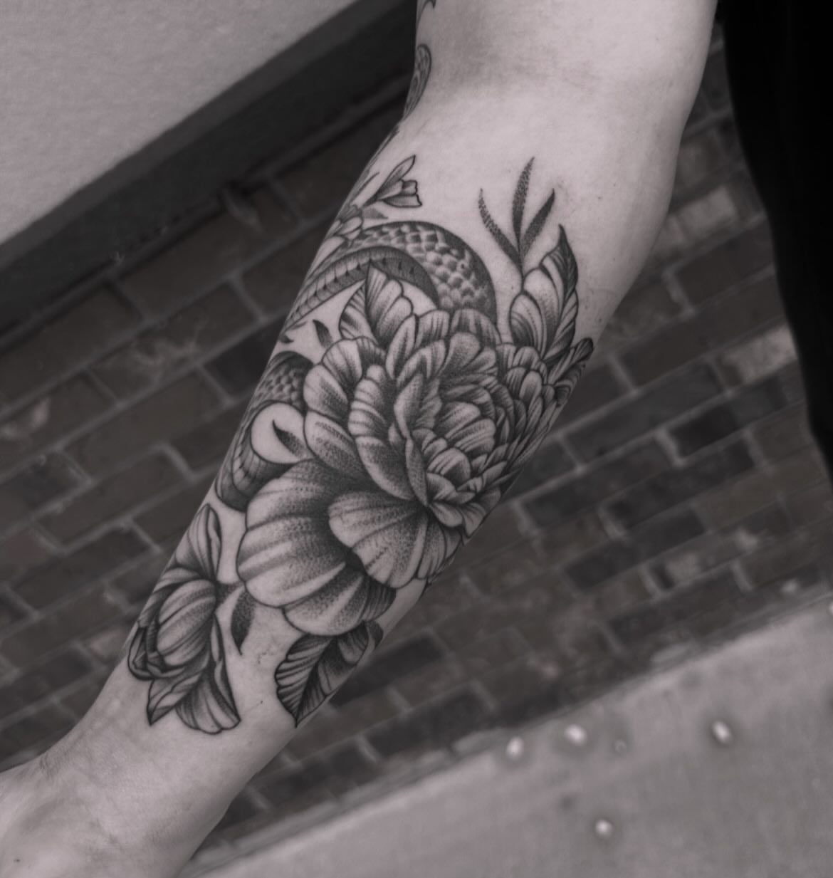 Peony and snake realism tattoo on the forearm by Anna Nicole Thomas
