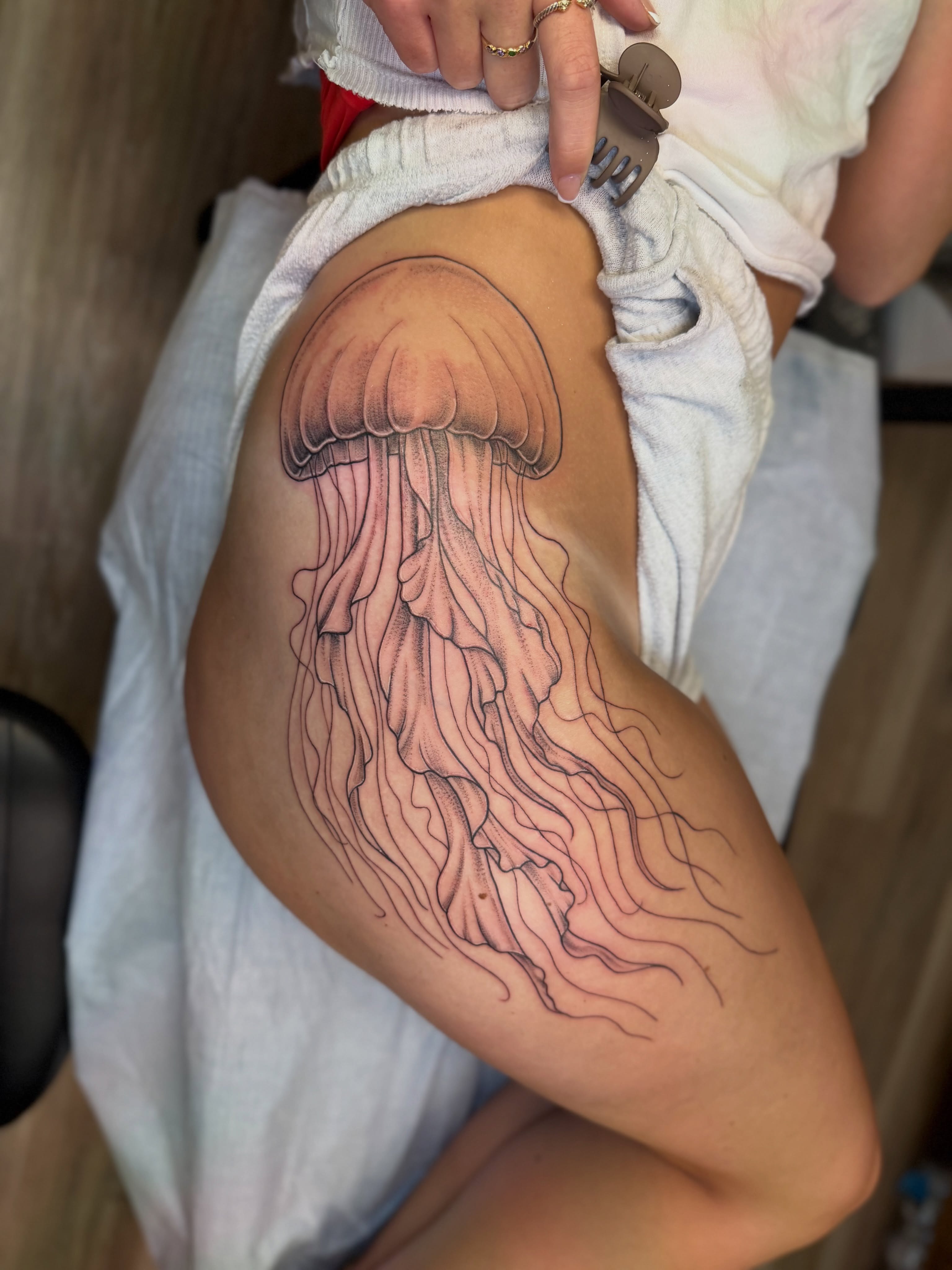 Jellyfish realism tattoo on the thigh by McKenna