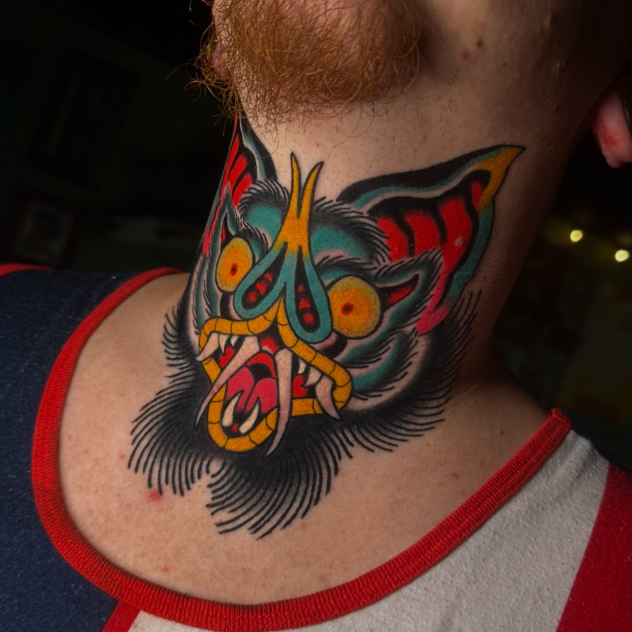 Mask American traditional tattoo on the neck by Schyler Ames, Canal Fulton, Ohio