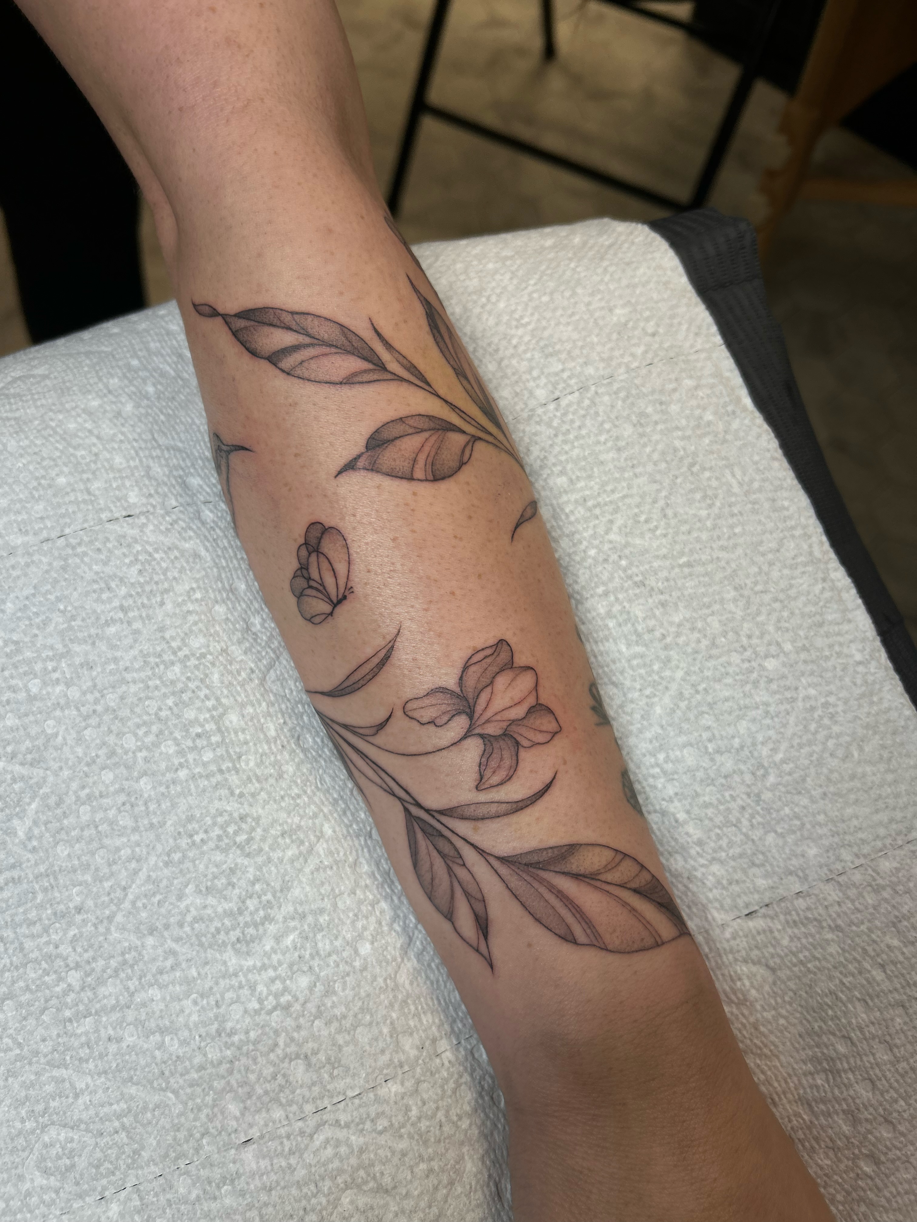 Floral vine black and grey tattoo on the forearm by alyssa jade ⭐️