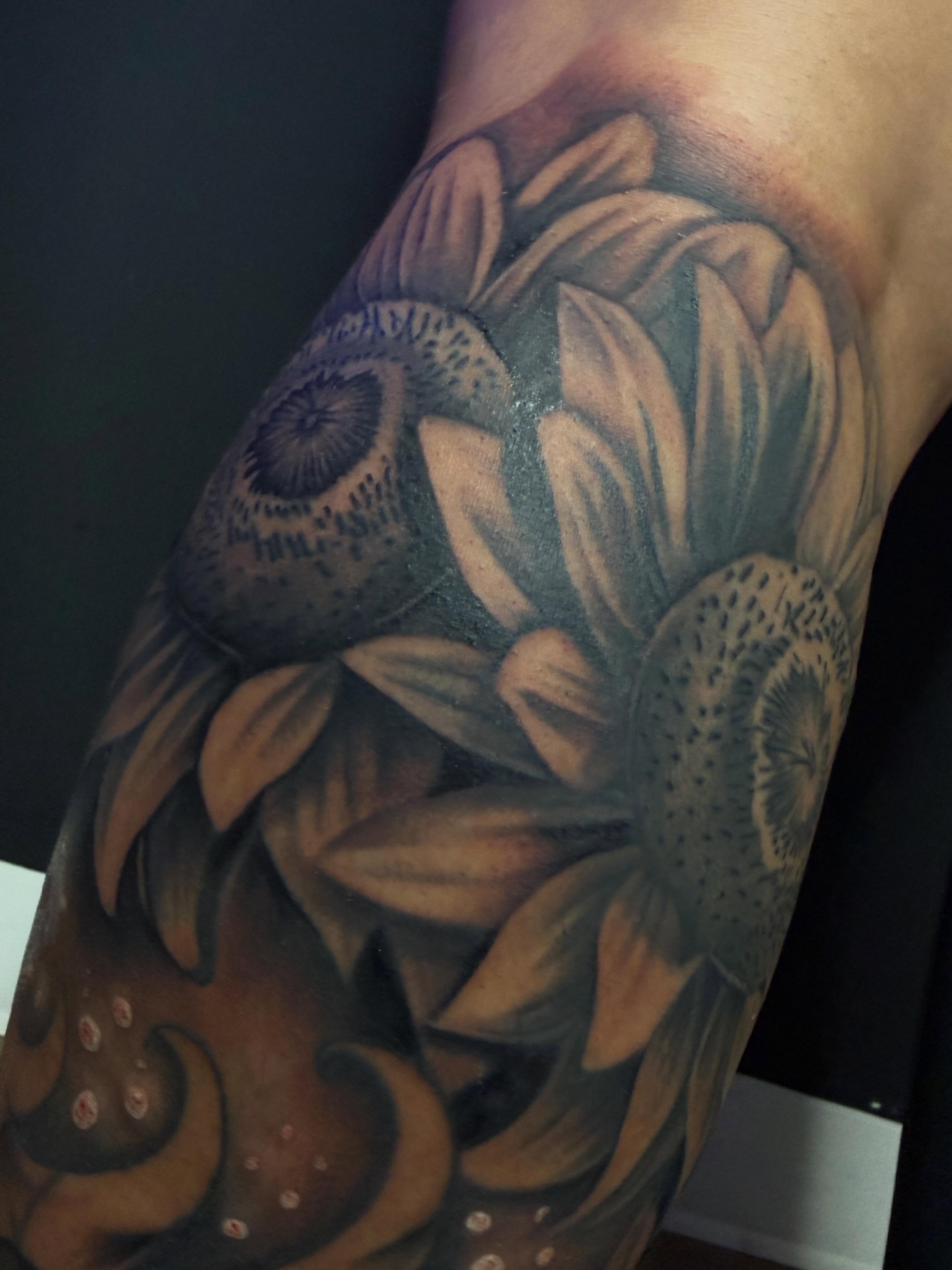 Sunflowers realism tattoo on the forearm by San Diego Tattoo Artist