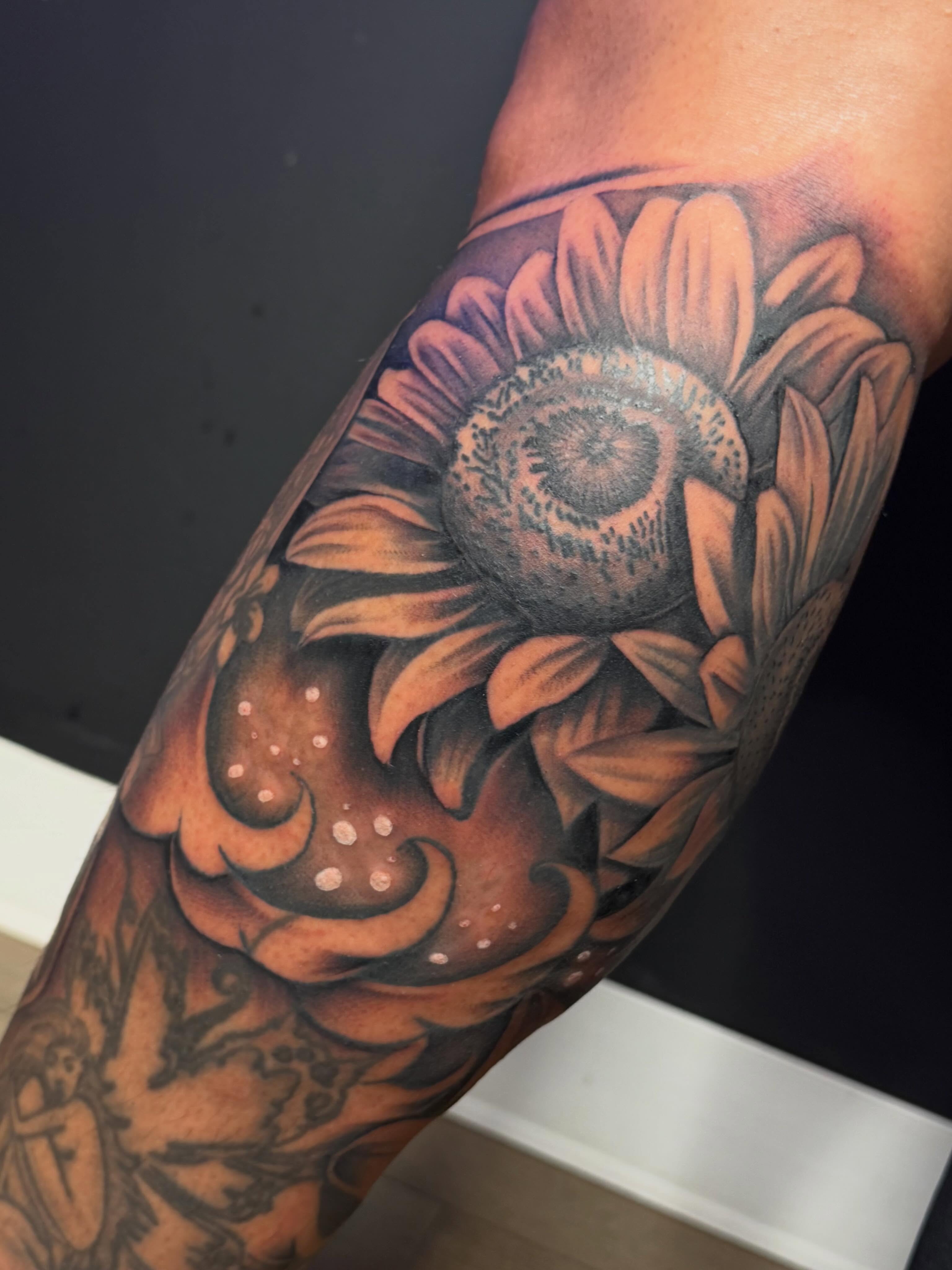 Sunflower realism tattoo on the forearm by San Diego Tattoo Artist