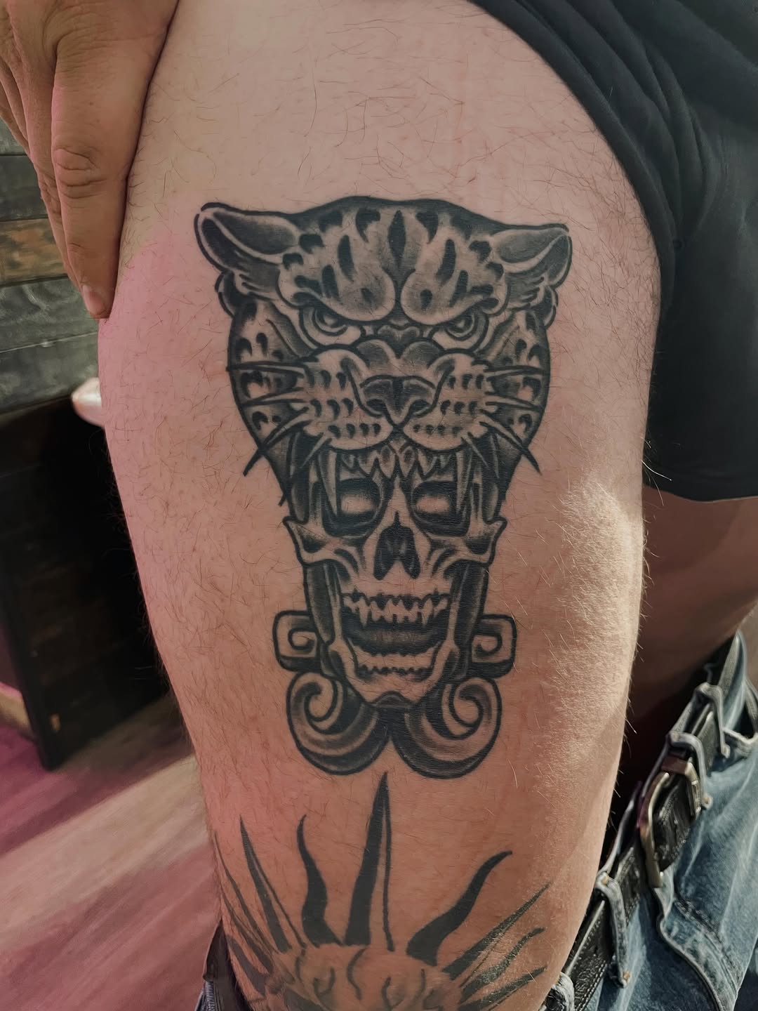Jaguar and skull realism tattoo on the thigh by Christien Xavier Alba, Salt Lake City, Utah