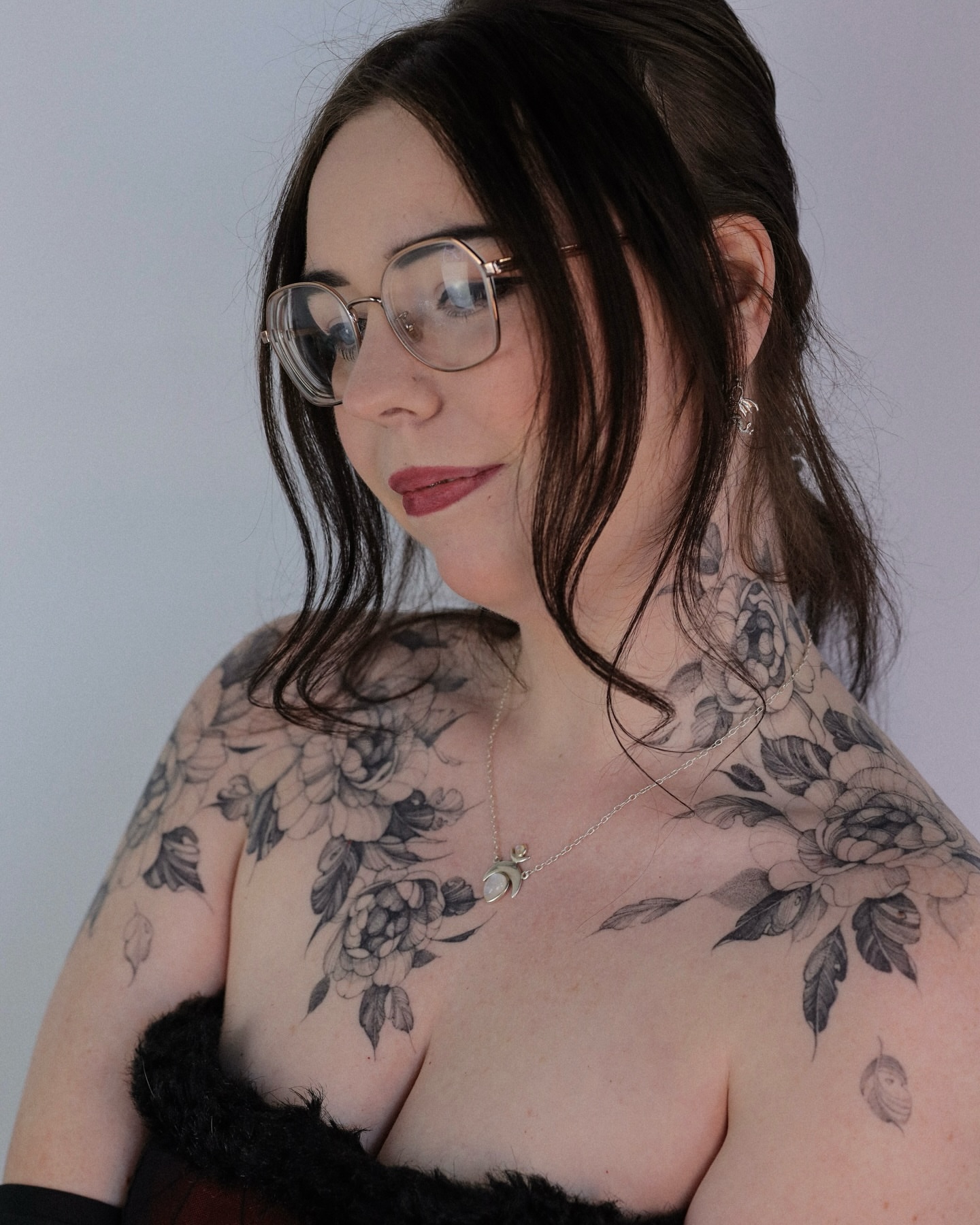 Floral black and grey tattoo on the chest by Maria