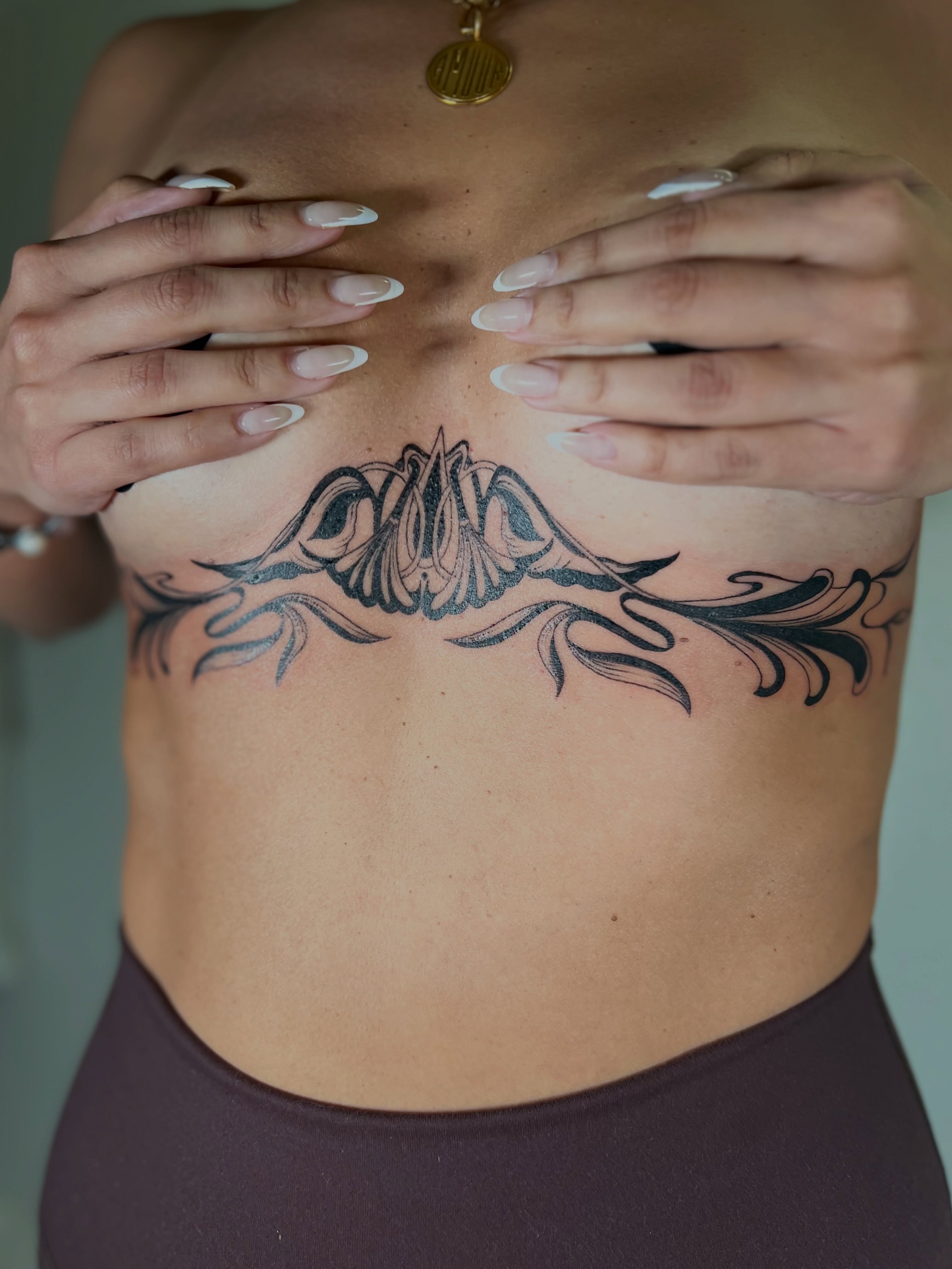 Floral design tribal tattoo on the ribs by Alex