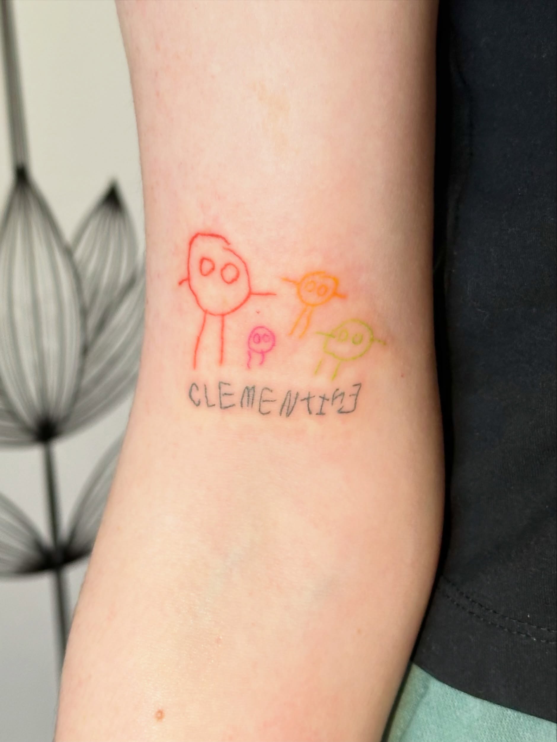 Stick figures minimalist tattoo on the forearm by Liz