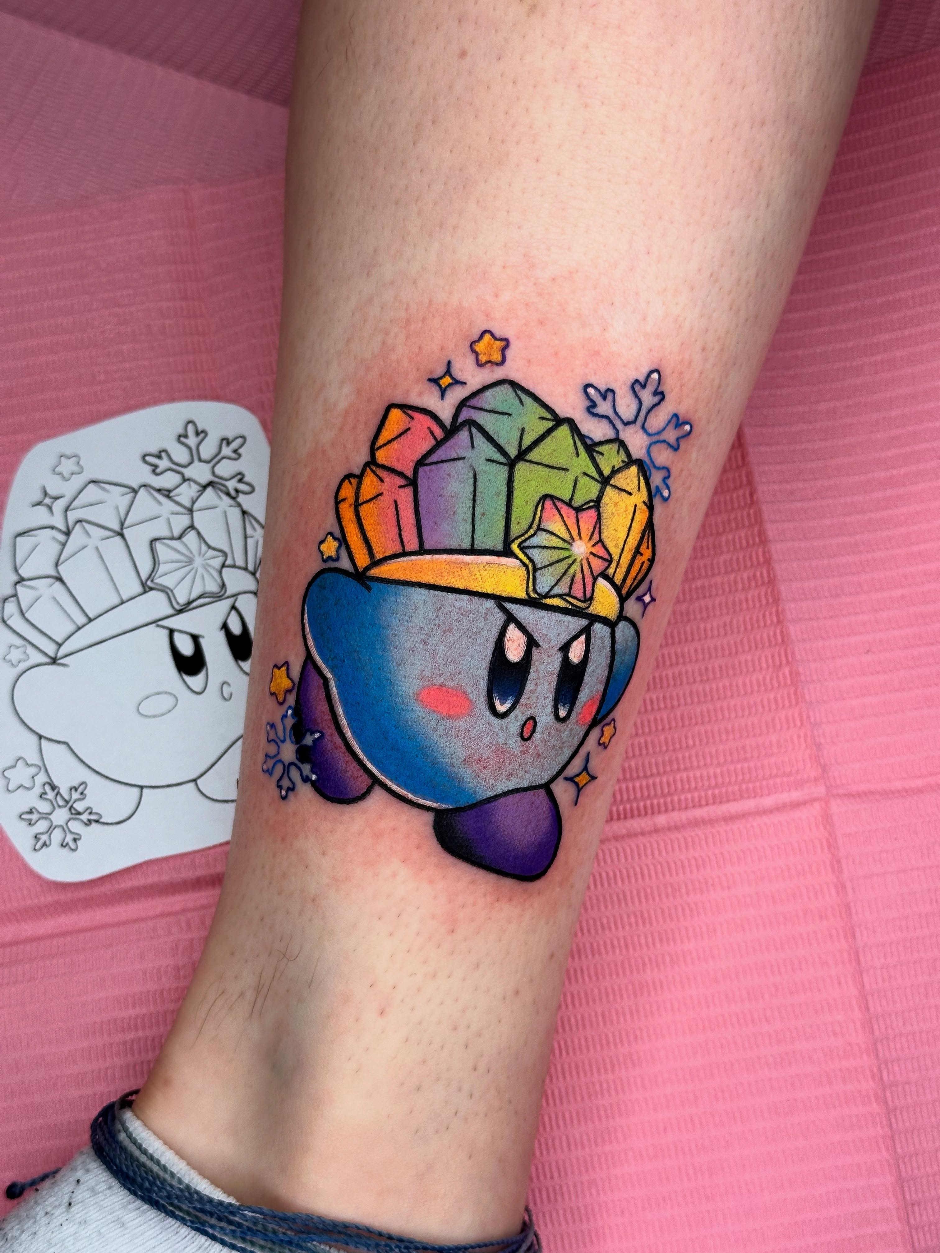 Kirby with crystal crown new school tattoo on the forearm by Isabel