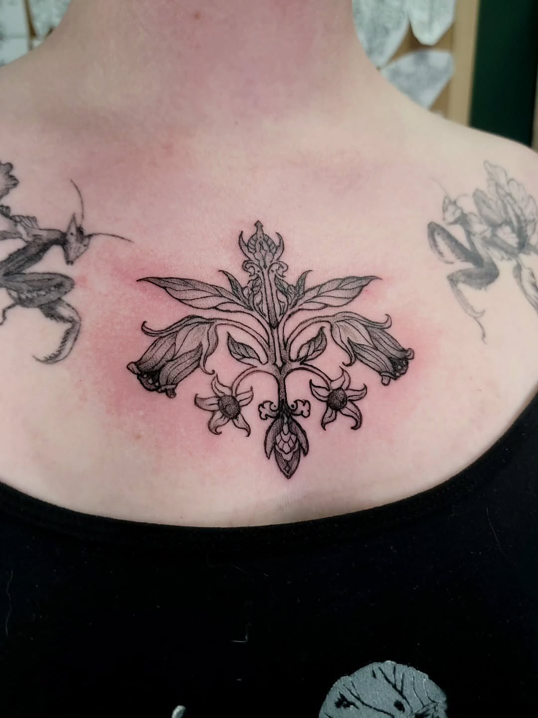 Bellflower black and grey tattoo on the neck by Nathan Harkins-Oberbeck