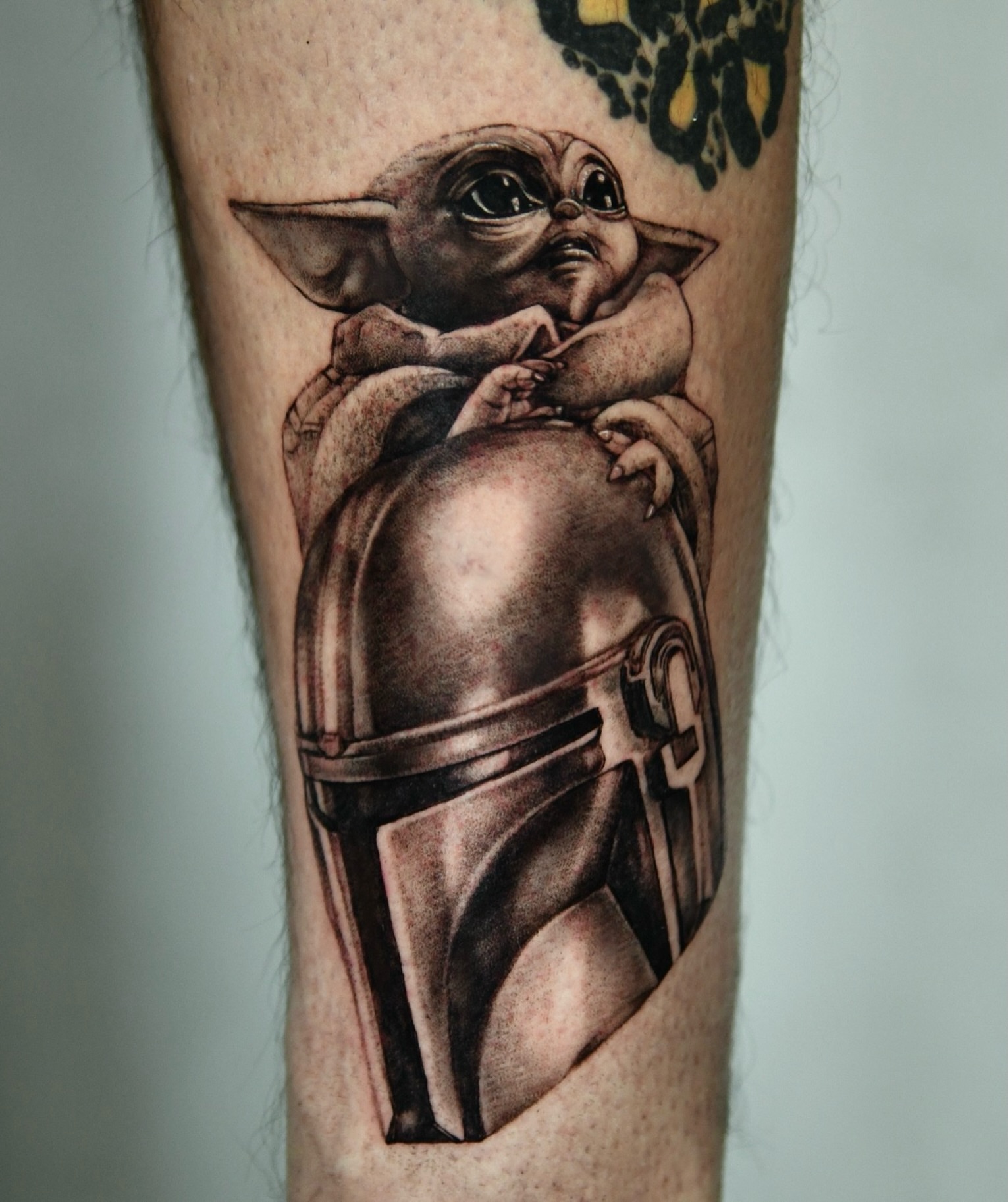 Baby Yoda realism tattoo on the forearm by Milk Tattoos 🇸🇻🇪🇸