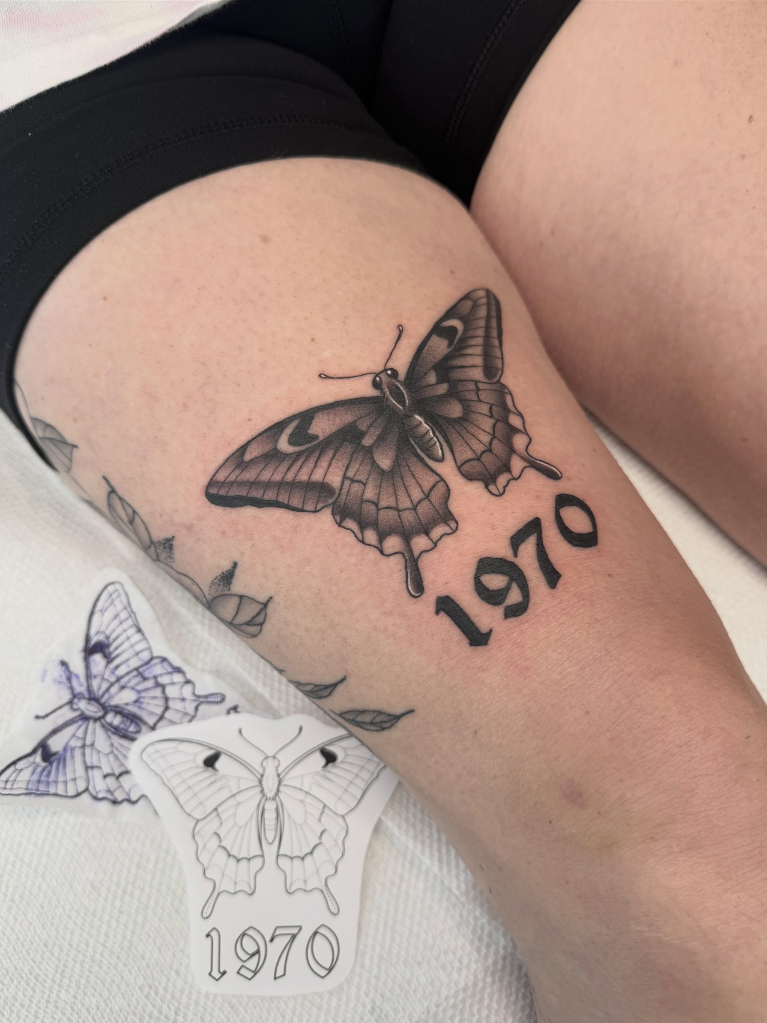 Butterfly black and grey tattoo on the thigh by Alisa (Li) Affatato ๐ผ