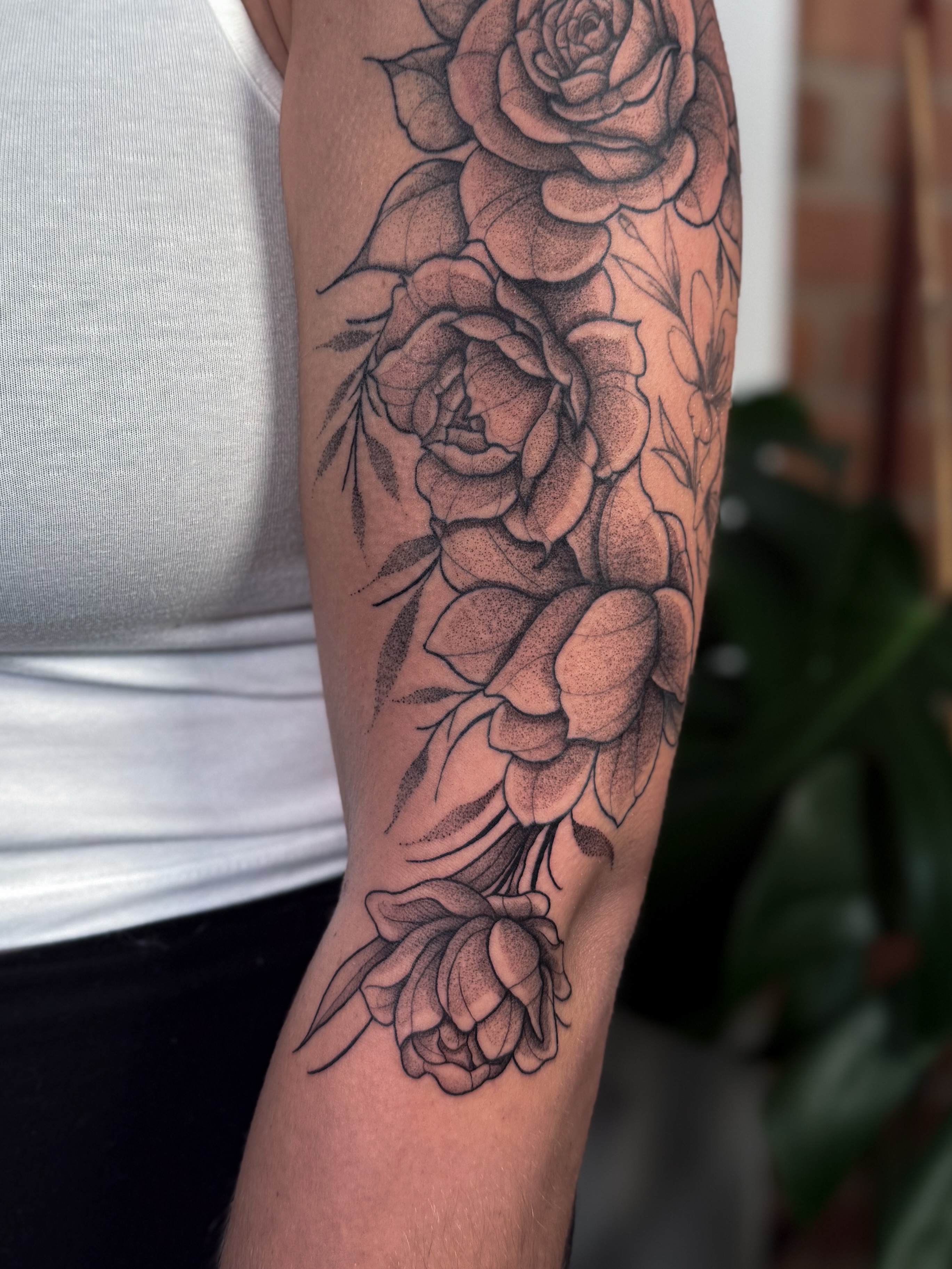 Roses black and grey tattoo on the forearm by Jessica Bloom
